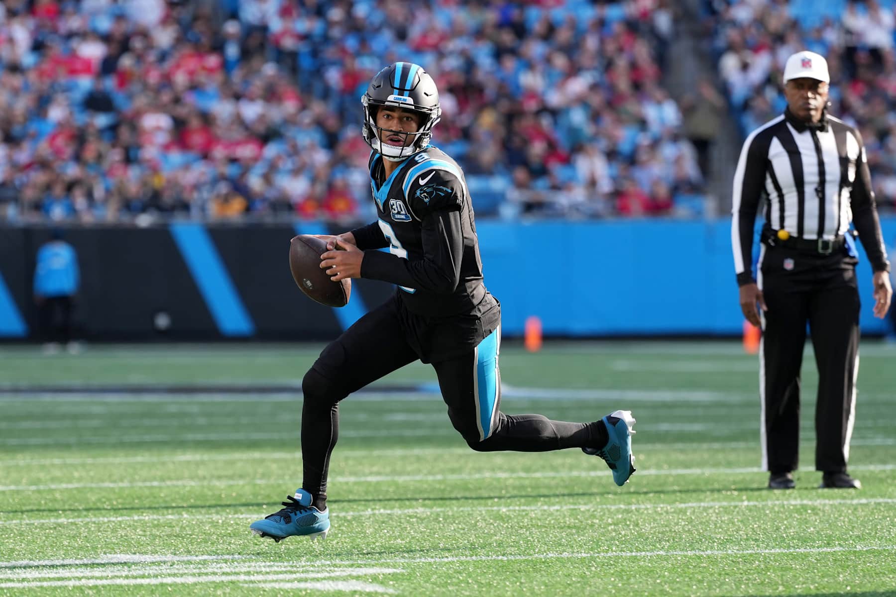 CHARLOTTE, NORTH CAROLINA - NOVEMBER 24: Quarterback Bryce Young #9 of the Carolina Panthers rolls out of the pocket during the third quarter against the Kansas City Chiefs at Bank of America Stadium on November 24, 2024 in Charlotte, North Carolina. (Photo by Grant Halverson/Getty Images) CHARLOTTE, NORTH CAROLINA - NOVEMBER 24: Quarterback Bryce Young #9 of the Carolina Panthers rolls out of the pocket during the third quarter against the Kansas City Chiefs at Bank of America Stadium on November 24, 2024 in Charlotte, North Carolina. (Photo by Grant Halverson/Getty Images)