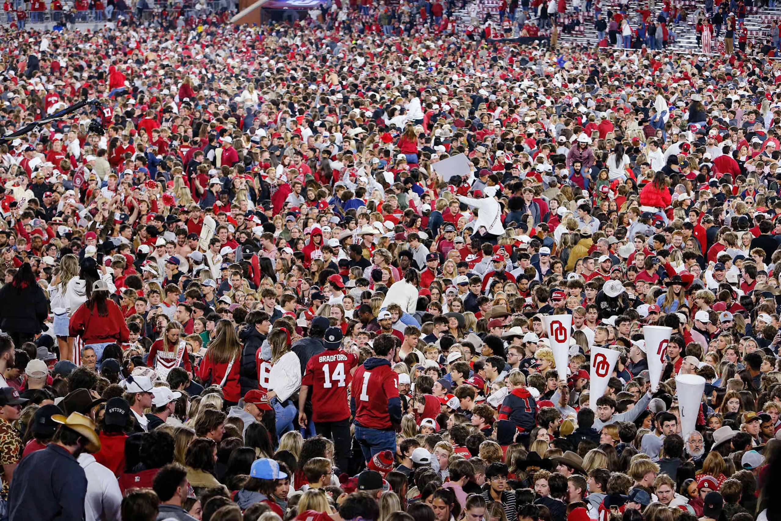 NORMAN, OKLAHOMA - NOVEMBER 23:  Oklahoma Sooners fans storm the field after the Oklahoma Sooners defeated the Alabama Crimson Tide 24-3 at Gaylord Family Oklahoma Memorial Stadium on November 23, 2024 in Norman, Oklahoma.  Oklahoma won 24-3. (Photo by Brian Bahr/Getty Images)