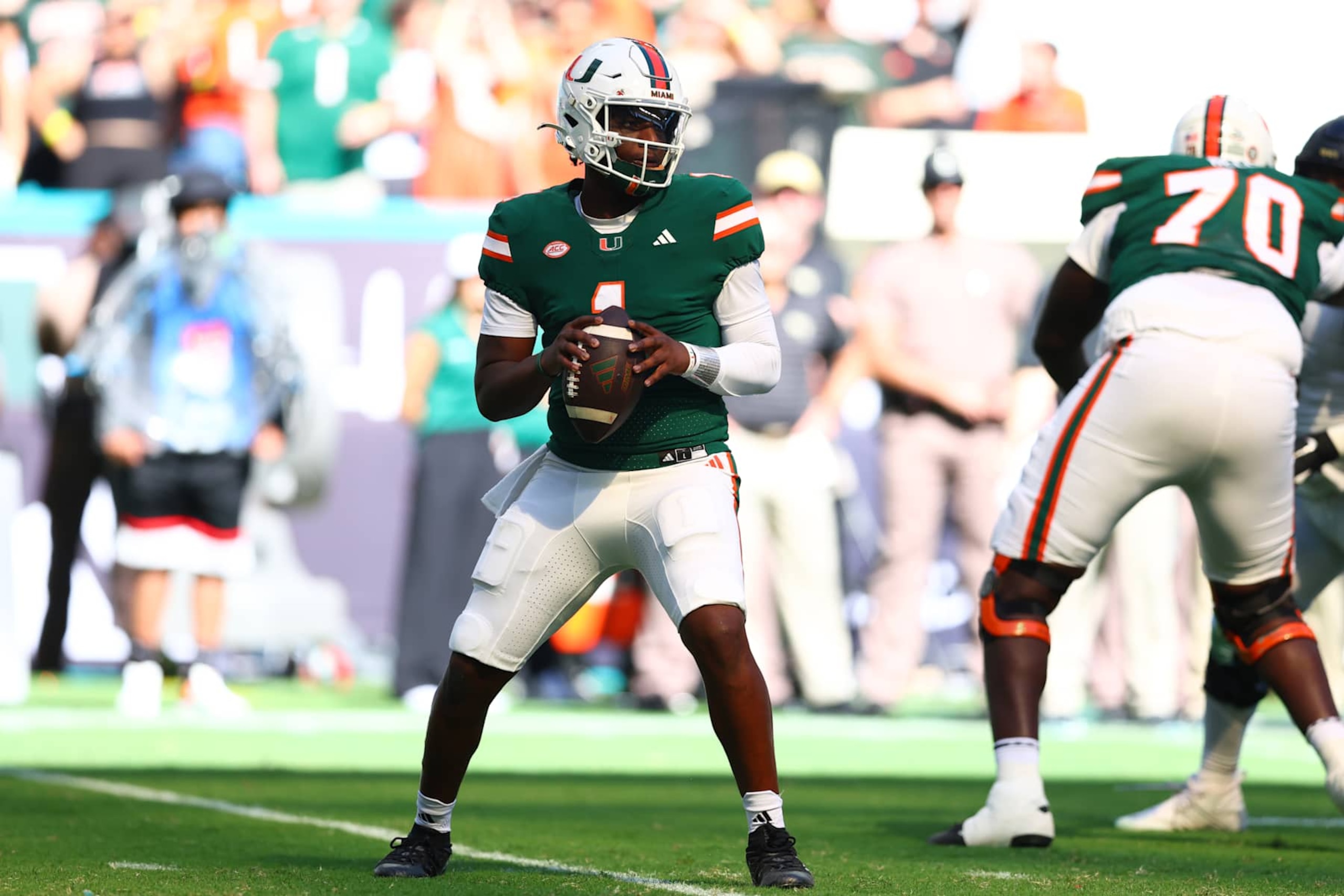 MIAMI GARDENS, FLORIDA - NOVEMBER 23: Cam Ward #1 of the Miami Hurricanes looks to pass against the Wake Forest Demon Deacons during the second quarter of the game at Hard Rock Stadium on November 23, 2024 in Miami Gardens, Florida. (Photo by Megan Briggs/Getty Images)