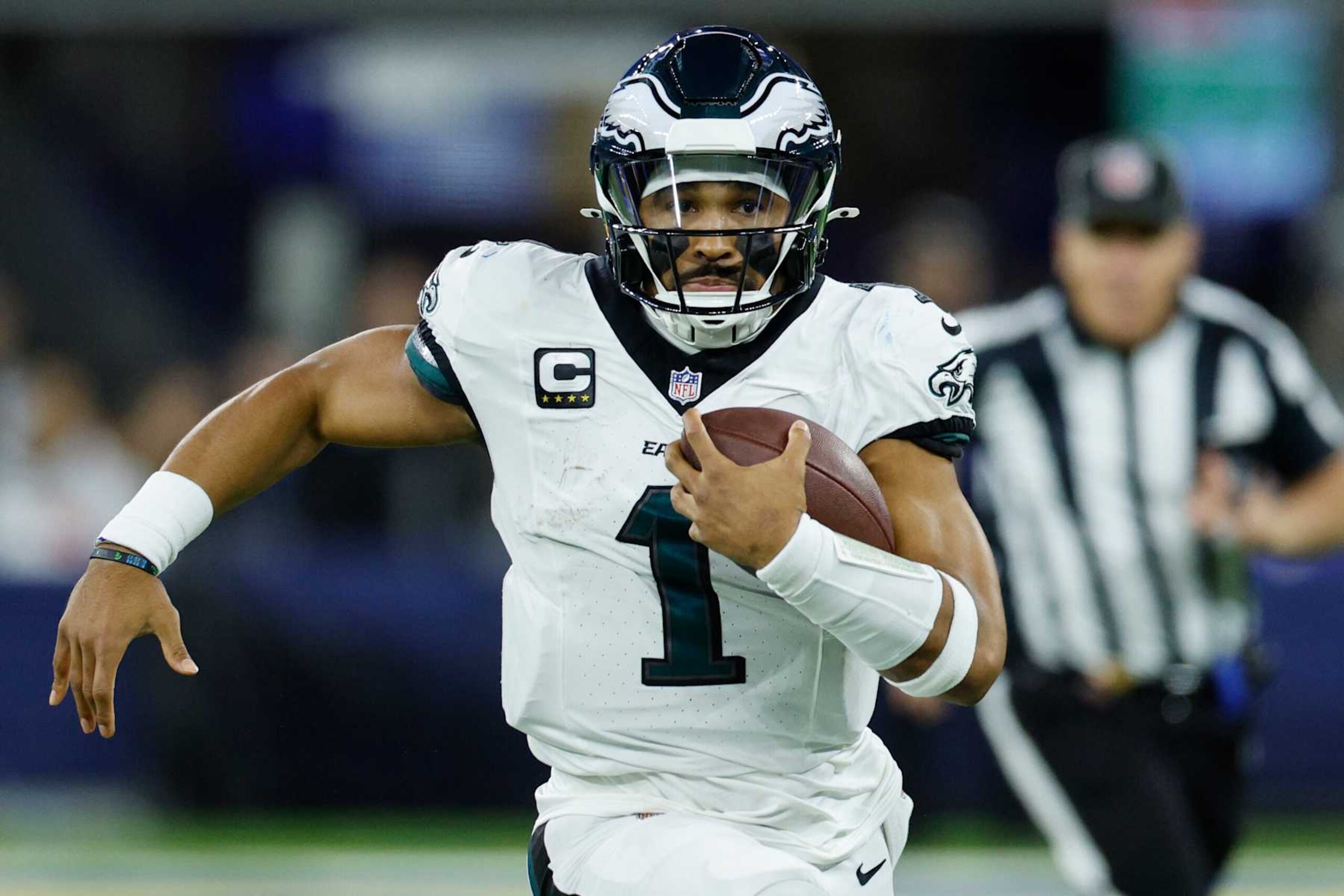 INGLEWOOD, CALIFORNIA - NOVEMBER 24: Jalen Hurts #1 of the Philadelphia Eagles runs with the ball during the first quarter against the Los Angeles Rams at SoFi Stadium on November 24, 2024 in Inglewood, California. (Photo by Kevork Djansezian/Getty Images)