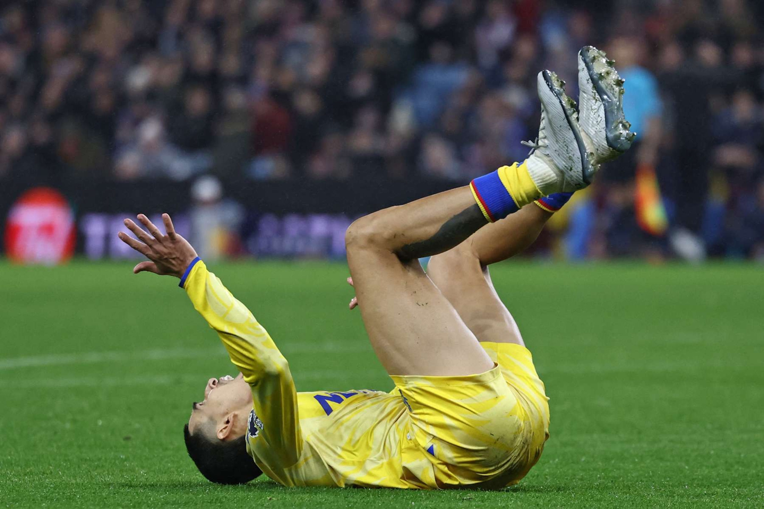 Crystal Palace's Colombian defender #12 Daniel Munoz reacts after missing a chance during the English Premier League football match between Aston Villa and Crystal Palace at Villa Park in Birmingham, central England on November 23, 2024. (Photo by Darren Staples / AFP) / RESTRICTED TO EDITORIAL USE. No use with unauthorized audio, video, data, fixture lists, club/league logos or 'live' services. Online in-match use limited to 120 images. An additional 40 images may be used in extra time. No video emulation. Social media in-match use limited to 120 images. An additional 40 images may be used in extra time. No use in betting publications, games or single club/league/player publications. /  (Photo by DARREN STAPLES/AFP via Getty Images)
