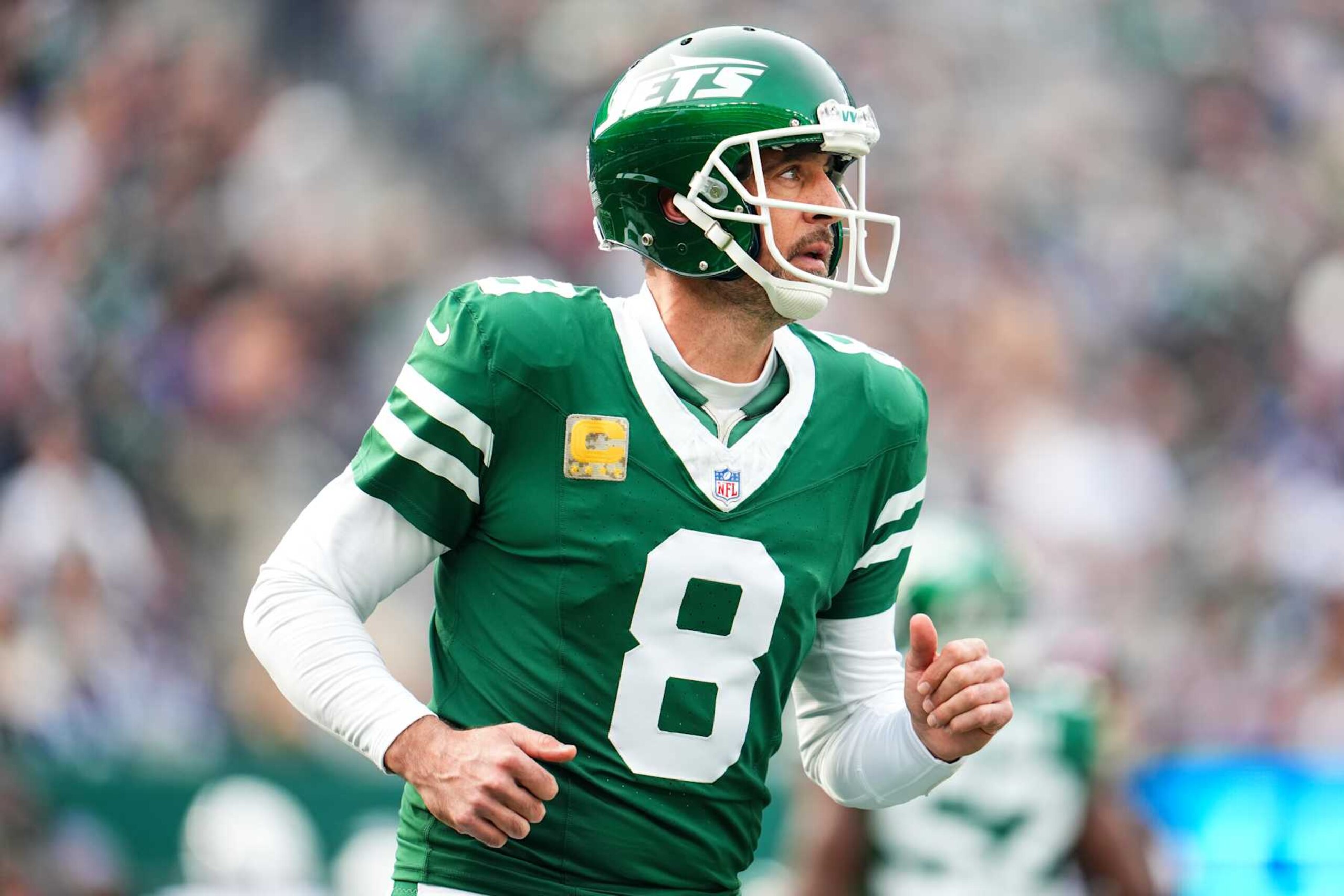 EAST RUTHERFORD, NJ - NOVEMBER 17: Aaron Rodgers #8 of the New York Jets looks on from the field during an NFL football game against the Indianapolis Colts at MetLife Stadium on November 17, 2024 in East Rutherford, New Jersey. (Photo by Cooper Neill/Getty Images)