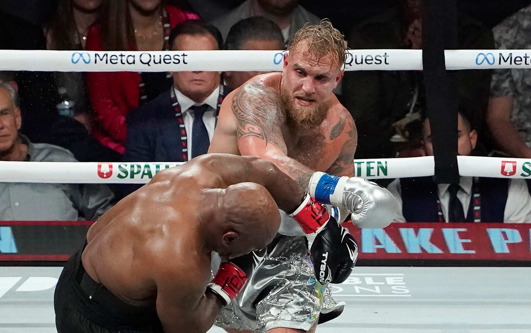 TOPSHOT - US retired pro-boxer Mike Tyson (L) and US YouTuber/boxer Jake Paul (R) fight during the heavyweight boxing bout at The Pavilion at AT&T Stadium in Arlington, Texas, November 15, 2024. (Photo by TIMOTHY A. CLARY / AFP) / ALTERNATE CROP (Photo by TIMOTHY A. CLARY/AFP via Getty Images)