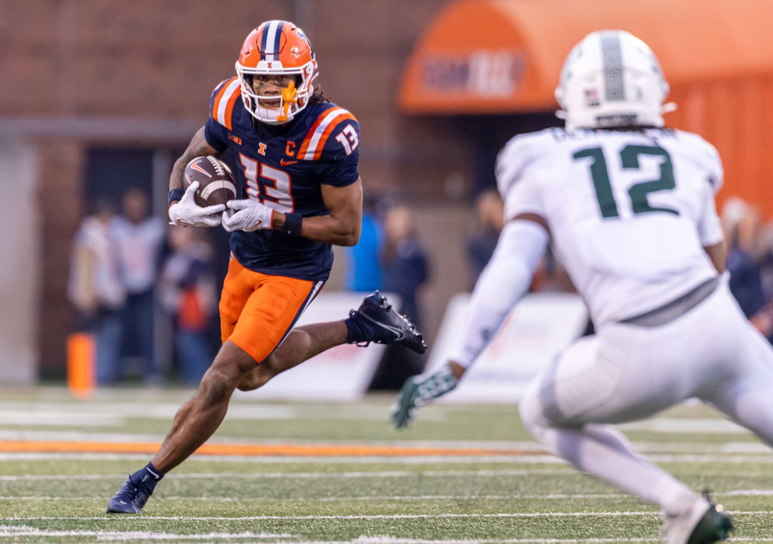 CHAMPAIGN, ILLINOIS - NOVEMBER 16: Pat Bryant #13 of the Illinois Fighting Illini runs the ball during the game against the Michigan State Spartans at Memorial Stadium on November 16, 2024 in Champaign, Illinois.  (Photo by Michael Hickey/Getty Images)