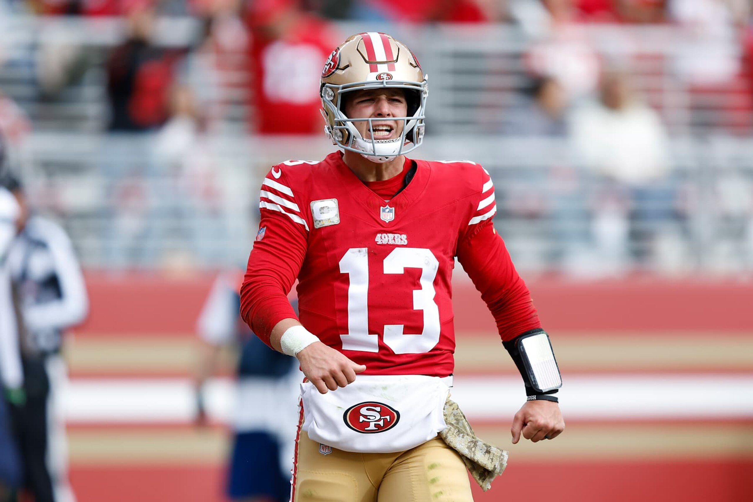SANTA CLARA, CALIFORNIA - NOVEMBER 17: Brock Purdy #13 of the San Francisco 49ers celebrates after scoring a touchdown in the first quarter against the Seattle Seahawks at Levi's Stadium on November 17, 2024 in Santa Clara, California. (Photo by Lachlan Cunningham/Getty Images)