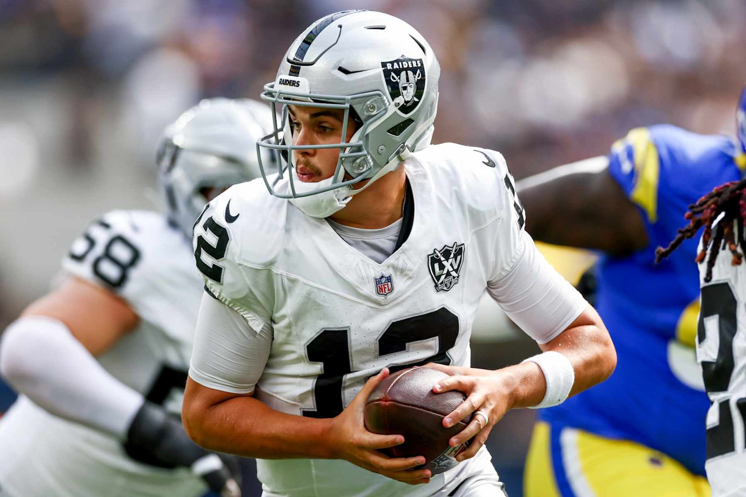 INGLEWOOD, CALIFORNIA - OCTOBER 20: Aidan O'Connell #12 of the Las Vegas Raiders runs with the ball against the Los Angeles Rams during the first quarter at SoFi Stadium on October 20, 2024 in Inglewood, California. (Photo by Katelyn Mulcahy/Getty Images)