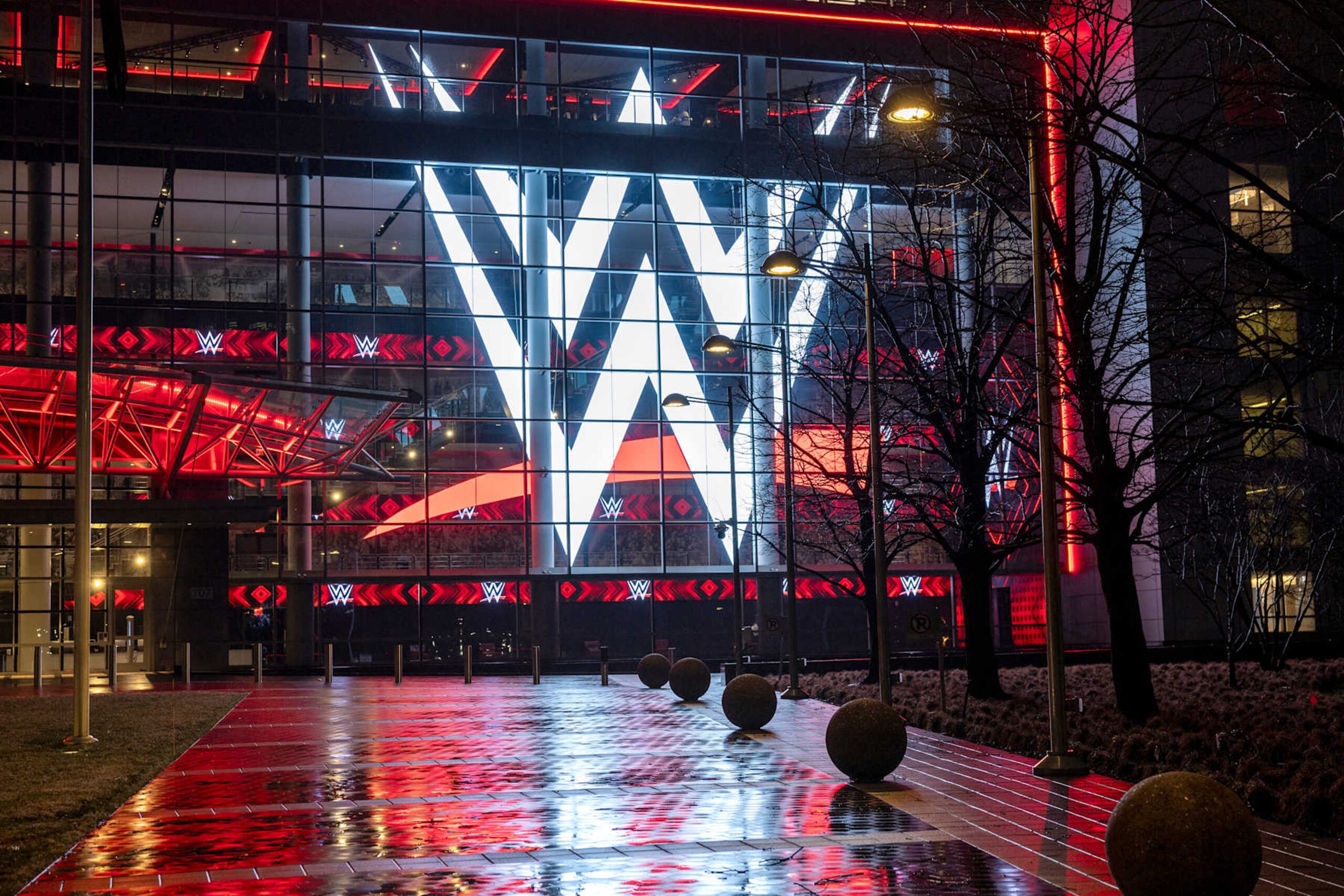 STAMFORD, CONNECTICUT - JANUARY 28: A giant WWE logo shines from the WWE world headquarters on January 28, 2024 in Stamford, Connecticut. WWE founder Vince McMahon resigned from the WWE and its parent company TKO as executive chairman and board of directors following allegations of sexual assault in a Connecticut lawsuit. A former employee Janel Grant accused McMahon, 78, of sexual assault and sexually trafficking her. (Photo by John Moore/Getty Images)