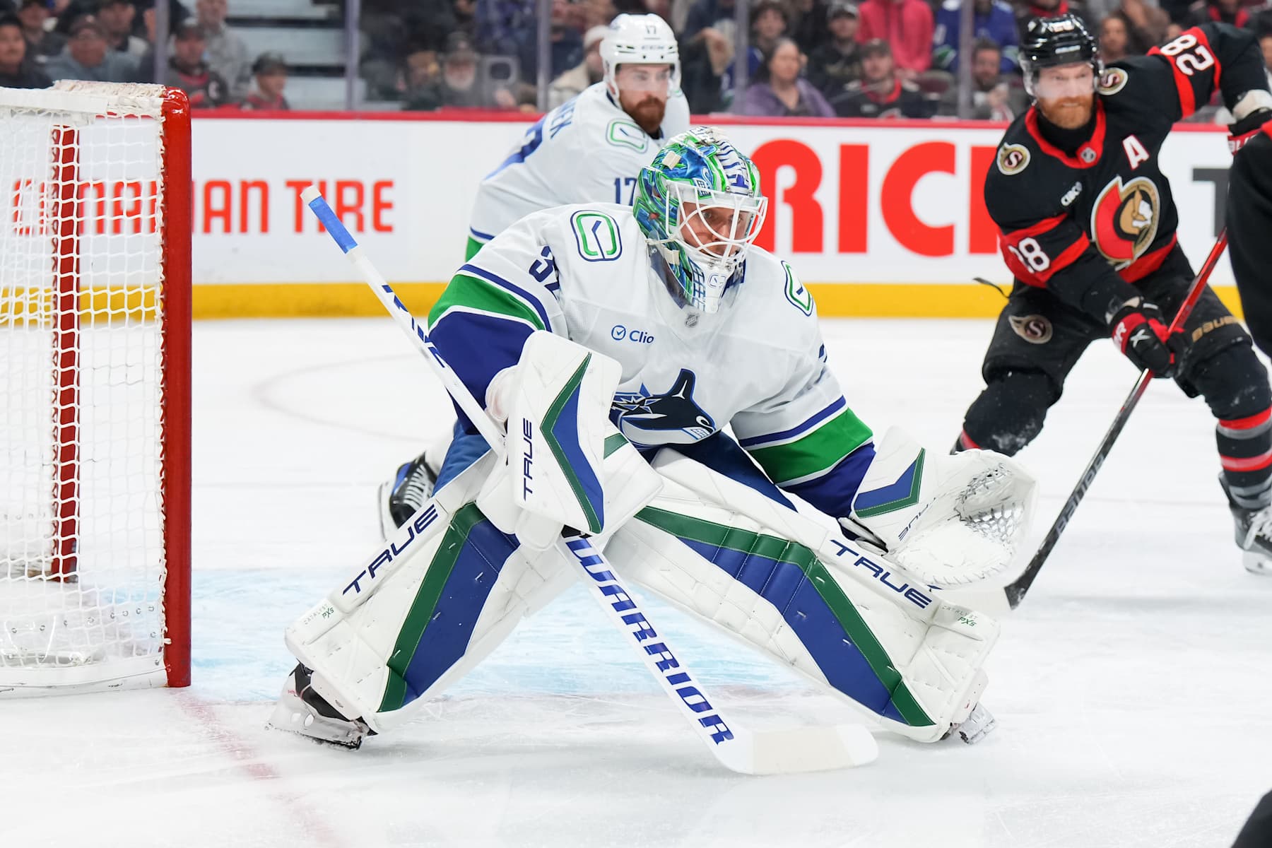 OTTAWA, CANADA - NOVEMBER 23:  Kevin Lankinen #32 of the Vancouver Canucks tends net against the Ottawa Senators at Canadian Tire Centre on November 23, 2024 in Ottawa, Ontario, Canada.  (Photo by André Ringuette/NHLI via Getty Images)