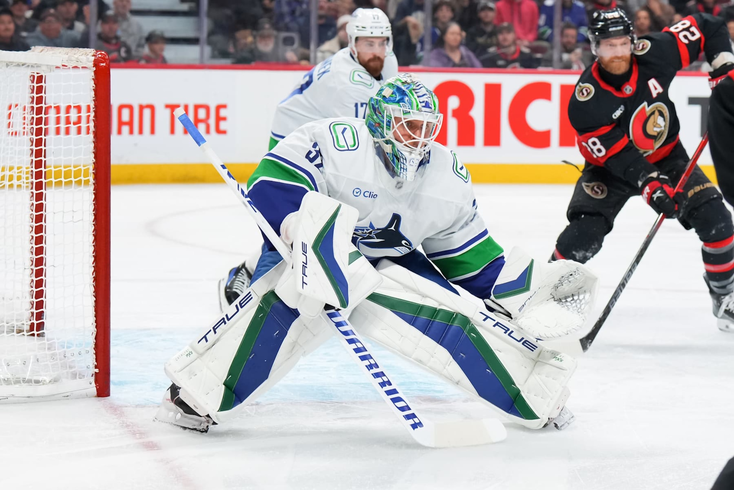 OTTAWA, CANADA - NOVEMBER 23:  Kevin Lankinen #32 of the Vancouver Canucks tends net against the Ottawa Senators at Canadian Tire Centre on November 23, 2024 in Ottawa, Ontario, Canada.  (Photo by André Ringuette/NHLI via Getty Images)