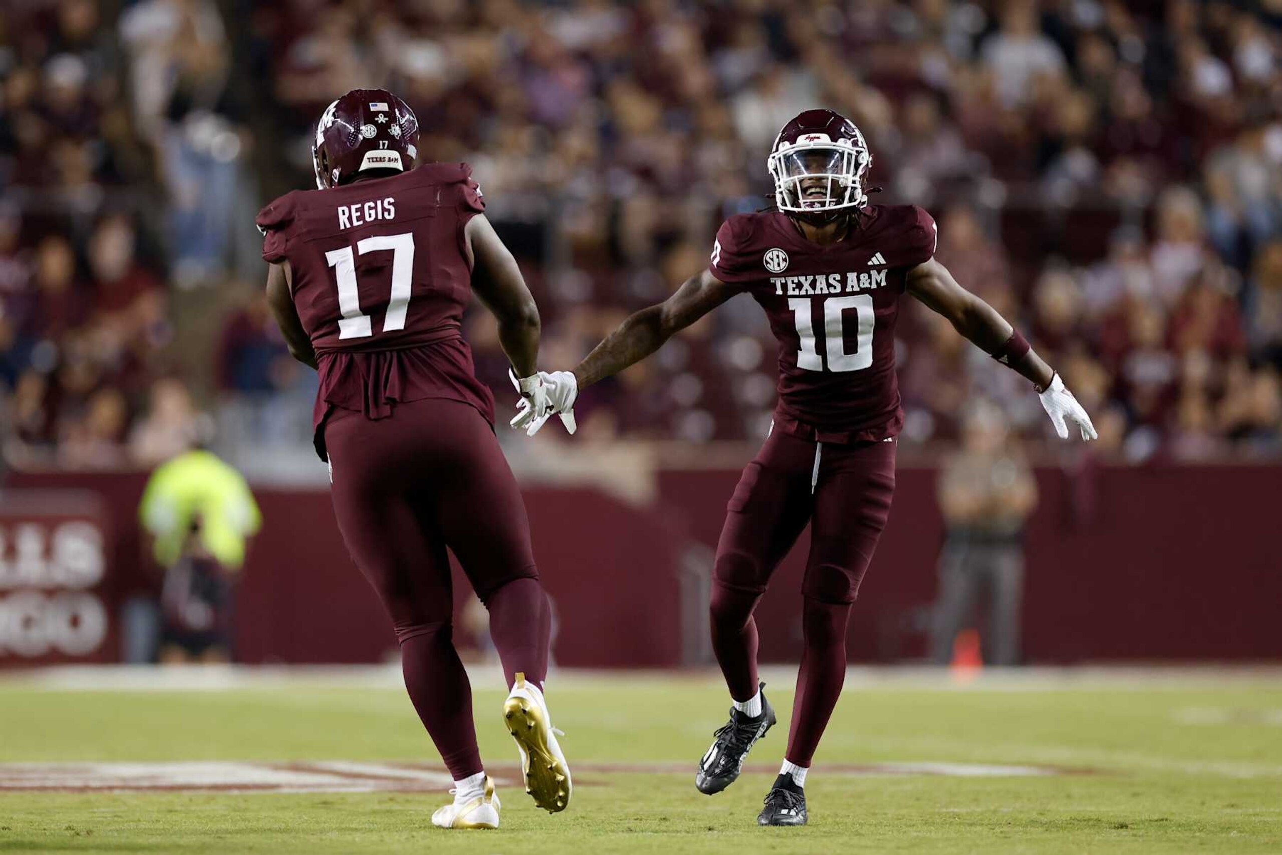COLLEGE STATION, TEXAS - NOVEMBER 16: Dezz Ricks #10 of the Texas A&M Aggies celebrates with Albert Regis #17 of the Texas A&M Aggies after a tackle in the second half against the New Mexico State Aggies at Kyle Field on November 16, 2024 in College Station, Texas. (Photo by Tim Warner/Getty Images) COLLEGE STATION, TEXAS - NOVEMBER 16: Dezz Ricks #10 of the Texas A&M Aggies celebrates with Albert Regis #17 of the Texas A&M Aggies after a tackle in the second half against the New Mexico State Aggies at Kyle Field on November 16, 2024 in College Station, Texas. (Photo by Tim Warner/Getty Images)