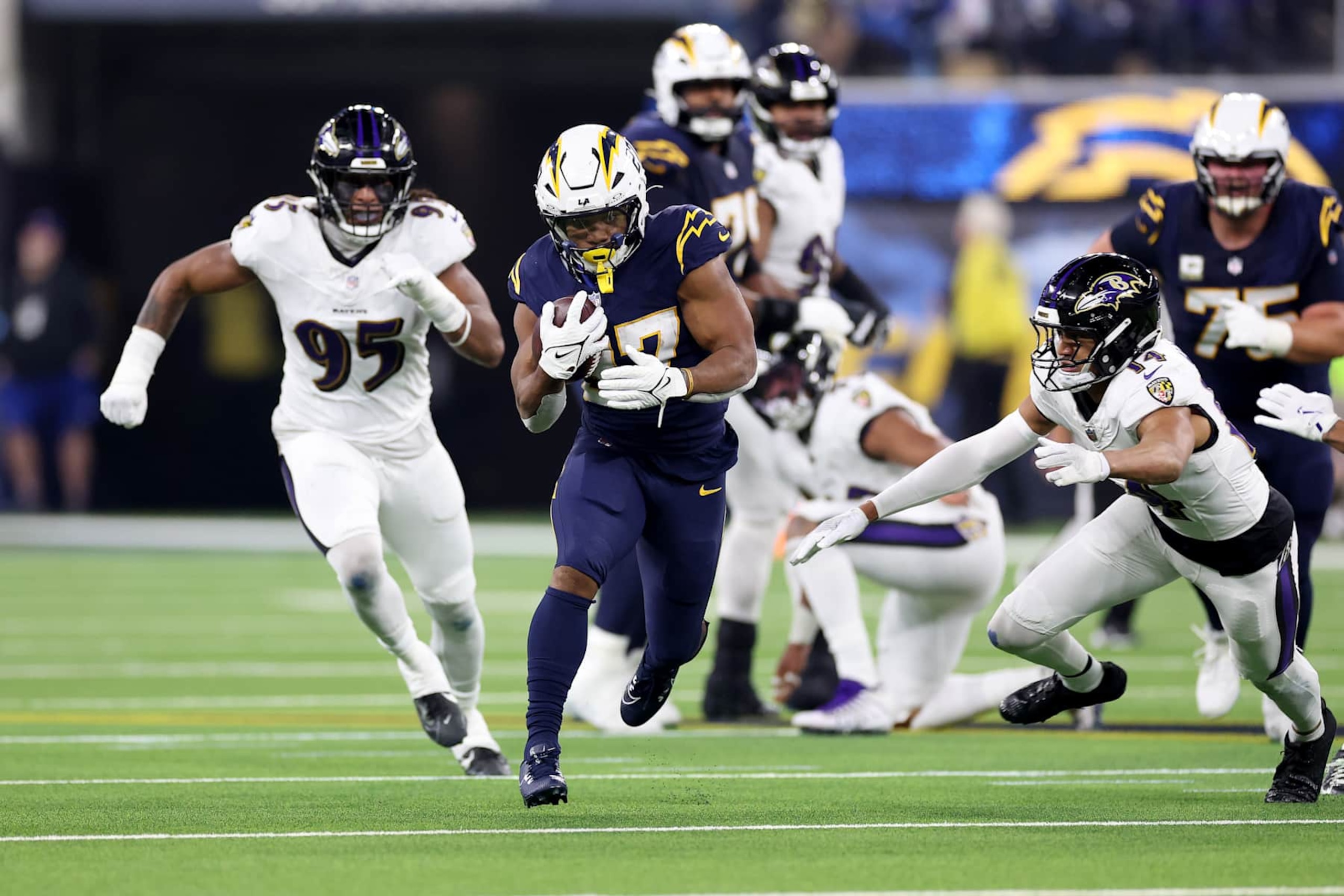 INGLEWOOD, CALIFORNIA - NOVEMBER 25: J.K. Dobbins #27 of the Los Angeles Chargers runs with the ball against the Baltimore Ravens during the first quarter in the game at SoFi Stadium on November 25, 2024 in Inglewood, California. (Photo by Sean M. Haffey/Getty Images) INGLEWOOD, CALIFORNIA - NOVEMBER 25: J.K. Dobbins #27 of the Los Angeles Chargers runs with the ball against the Baltimore Ravens during the first quarter in the game at SoFi Stadium on November 25, 2024 in Inglewood, California. (Photo by Sean M. Haffey/Getty Images)