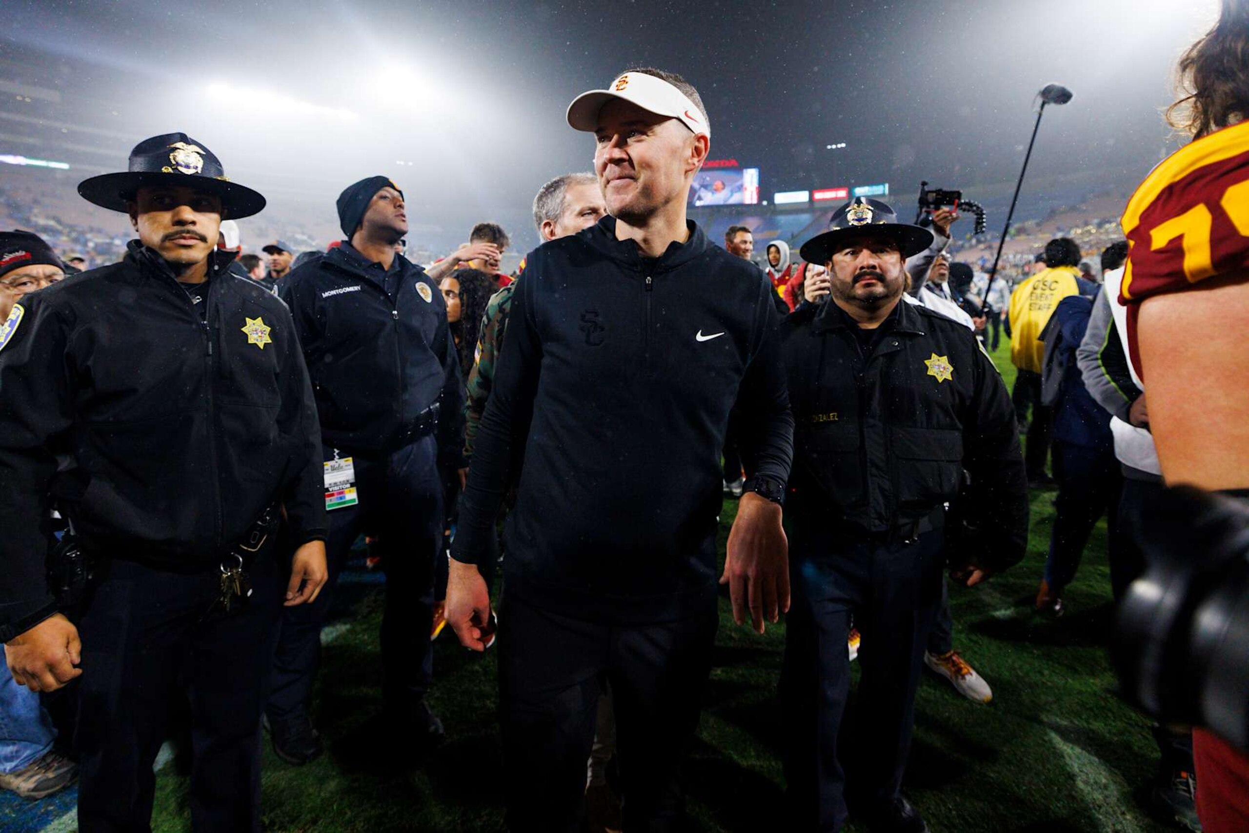 PASADENA, CALIFORNIA - NOVEMBER 23: Lincoln Riley of the USC Trojans smiles on the field after a game against UCLA Bruins at Rose Bowl on November 23, 2024 in Pasadena, California. (Photo by Ric Tapia/Getty Images) PASADENA, CALIFORNIA - NOVEMBER 23: Lincoln Riley of the USC Trojans smiles on the field after a game against UCLA Bruins at Rose Bowl on November 23, 2024 in Pasadena, California. (Photo by Ric Tapia/Getty Images)