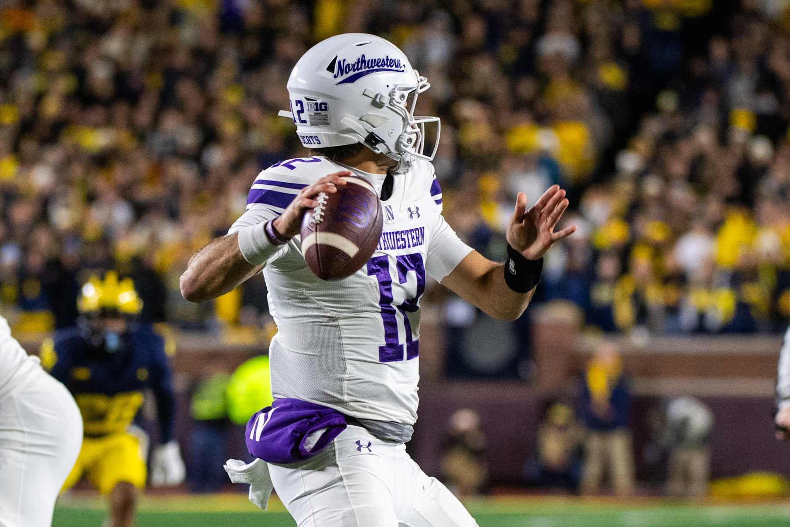 ANN ARBOR, MICHIGAN - NOVEMBER 23: Jack Lausch #12 of the Northwestern Wildcats looks to throw a pass downfield during the second half of a college football game against the Michigan Wolverines at Michigan Stadium on November 23, 2024 in Ann Arbor, Michigan. The Michigan Wolverines won the game 50-6. (Photo by Aaron J. Thornton/Getty Images) ANN ARBOR, MICHIGAN - NOVEMBER 23: Jack Lausch #12 of the Northwestern Wildcats looks to throw a pass downfield during the second half of a college football game against the Michigan Wolverines at Michigan Stadium on November 23, 2024 in Ann Arbor, Michigan. The Michigan Wolverines won the game 50-6. (Photo by Aaron J. Thornton/Getty Images)