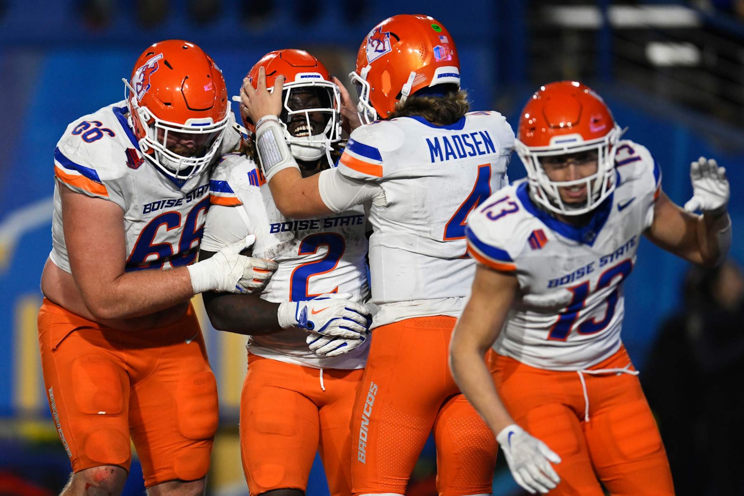 SAN JOSE, CALIFORNIA - NOVEMBER 16: Ashton Jeanty #2 of the Boise State Broncos celebrates his touchdown with Ben Dooley #66 and Maddux Madsen #4 during a game against the San Jose State Spartans in the fourth quarter at CEFCU Stadium on November 16, 2024 in San Jose, California.  (Photo by Eakin Howard/Getty Images)
