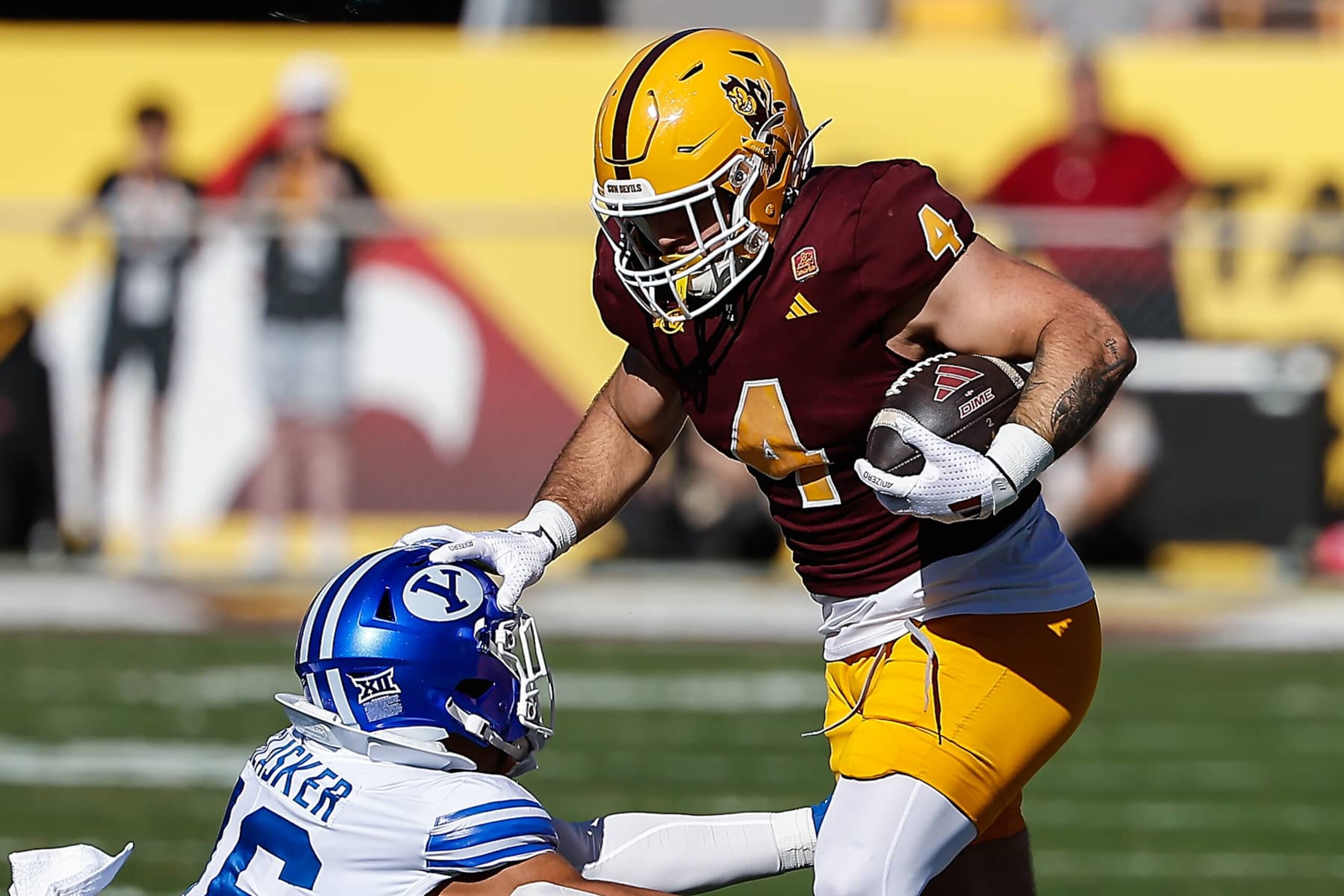 TEMPE, AZ - NOVEMBER 23:  Arizona State Sun Devils running back Cam Skattebo (4) runs the ball during the college football game between the BYU Cougars and the Arizona State Sun Devils on November 23, 2024 at Mountain America Stadium in Tempe, Arizona. (Photo by Kevin Abele/Icon Sportswire via Getty Images)