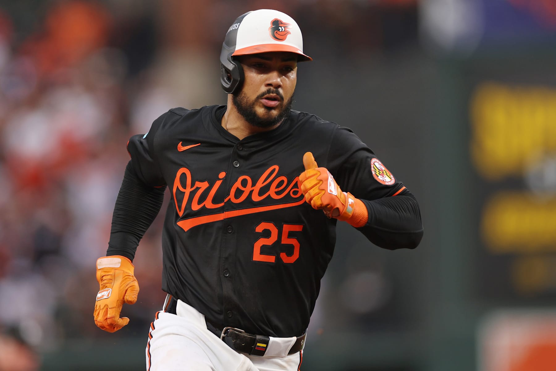 BALTIMORE, MARYLAND - OCTOBER 02: Anthony Santander #25 of the Baltimore Orioles advances to third base on a fielder's choice against the Kansas City Royals hit by Ryan O'Hearn (not pictured) during the fourth inning of Game Two of the Wild Card Series at Oriole Park at Camden Yards on October 02, 2024 in Baltimore, Maryland.  (Photo by Patrick Smith/Getty Images)