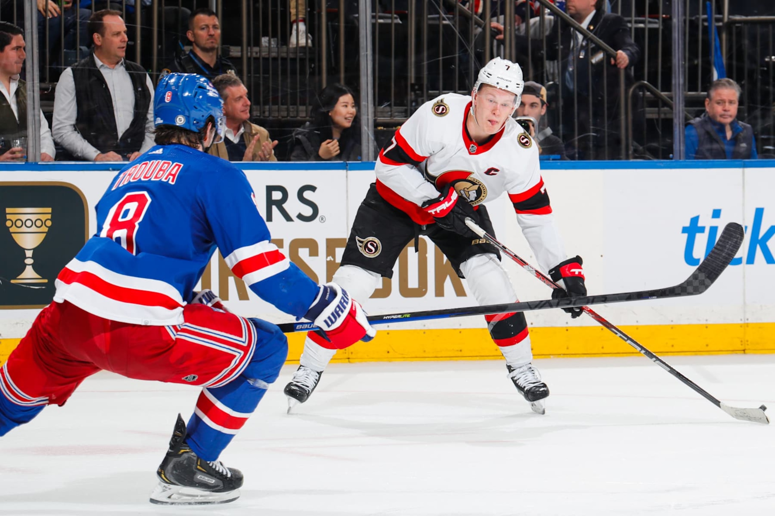 NEW YORK, NEW YORK - MARCH 02:  Brady Tkachuk #7 of the Ottawa Senators skates with the puck against Jacob Trouba #8 of the New York Rangers at Madison Square Garden on March 2, 2023 in New York City. (Photo by Jared Silber/NHLI via Getty Images)