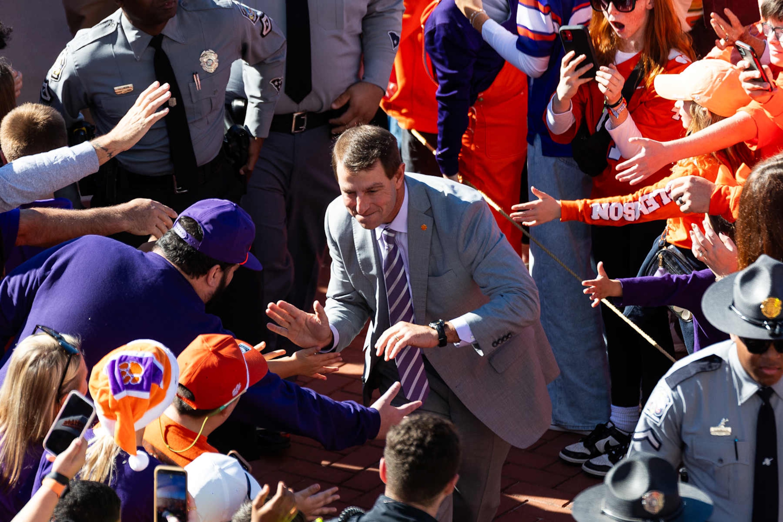 CLEMSON, SOUTH CAROLINA - NOVEMBER 23: Head coach Dabo Swinney of the Clemson Tigers meets fans during Tiger Walk before taking on the Citadel Bulldogs at Memorial Stadium on November 23, 2024 in Clemson, South Carolina. (Photo by Isaiah Vazquez/Getty Images) CLEMSON, SOUTH CAROLINA - NOVEMBER 23: Head coach Dabo Swinney of the Clemson Tigers meets fans during Tiger Walk before taking on the Citadel Bulldogs at Memorial Stadium on November 23, 2024 in Clemson, South Carolina. (Photo by Isaiah Vazquez/Getty Images)