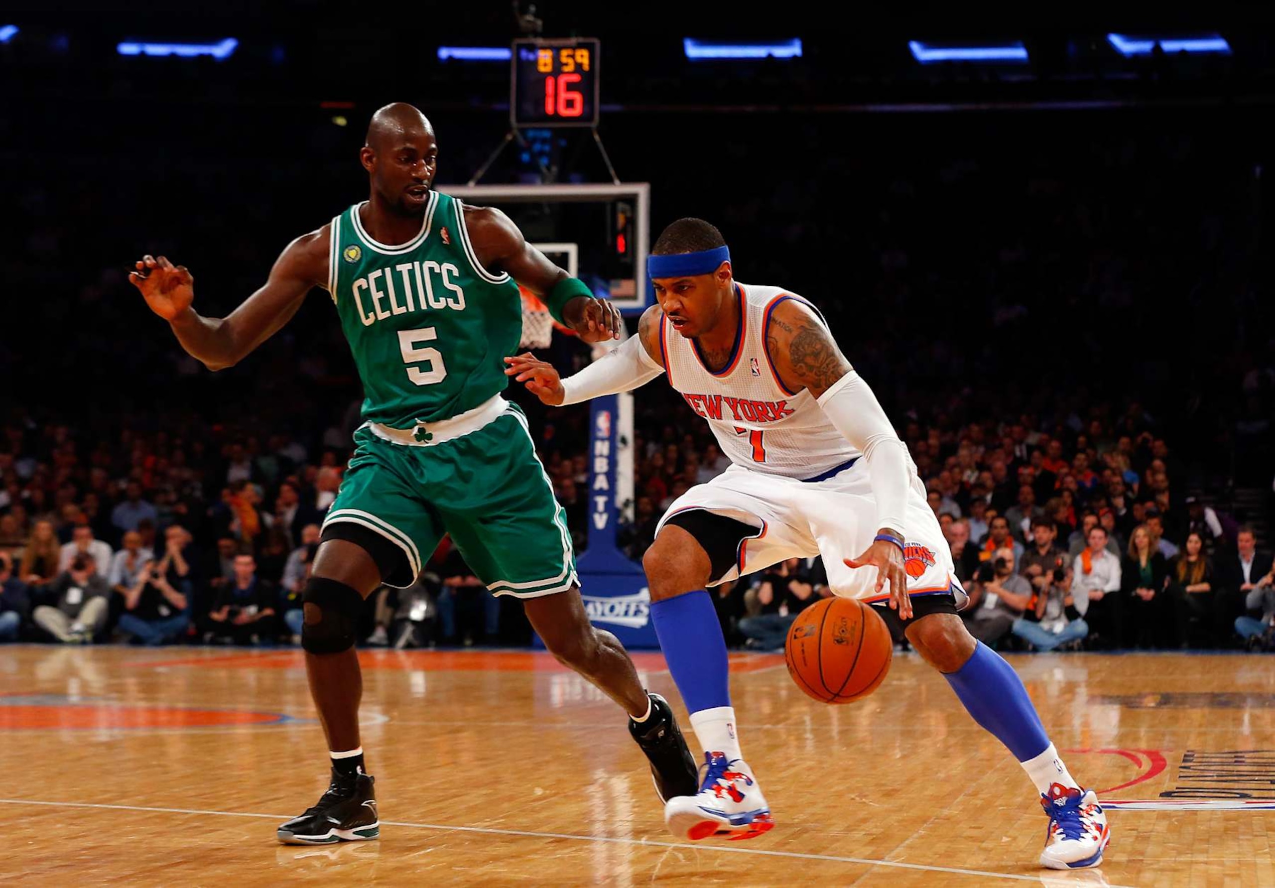 NEW YORK, NY - APRIL 23: (NEW YORK DAILIES OUT) Carmelo Anthony #7 of the New York Knicks in action against Kevin Garnett #5 of the Boston Celtics during Game Two of the Eastern Conference Quarterfinals of the 2013 NBA Playoffs on April 23, 2013 at Madison Square Garden in New York City. The Knicks defeated the Celtics 87-71. NOTE TO USER: User expressly acknowledges and agrees that, by downloading and/or using this Photograph, user is consenting to the terms and conditions of the Getty Images License Agreement. (Photo by Jim McIsaac/Getty Images) NEW YORK, NY - APRIL 23: (NEW YORK DAILIES OUT) Carmelo Anthony #7 of the New York Knicks in action against Kevin Garnett #5 of the Boston Celtics during Game Two of the Eastern Conference Quarterfinals of the 2013 NBA Playoffs on April 23, 2013 at Madison Square Garden in New York City. The Knicks defeated the Celtics 87-71. NOTE TO USER: User expressly acknowledges and agrees that, by downloading and/or using this Photograph, user is consenting to the terms and conditions of the Getty Images License Agreement. (Photo by Jim McIsaac/Getty Images)