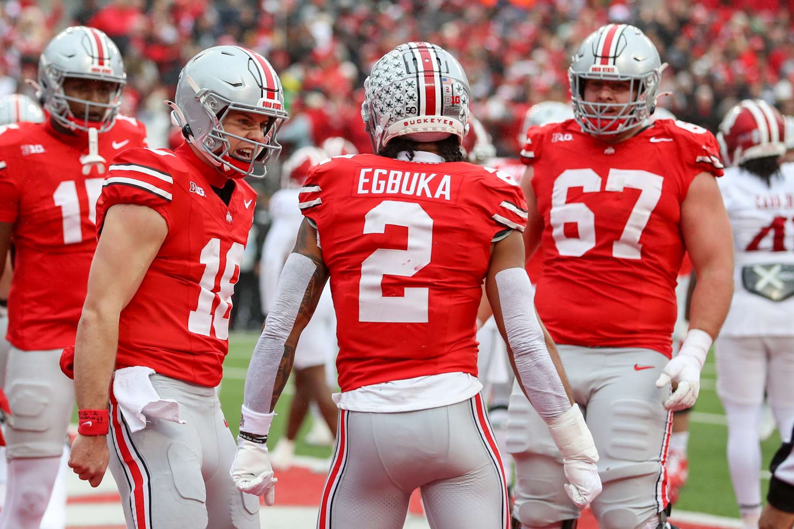 COLUMBUS, OH - NOVEMBER 23: Ohio State Buckeyes quarterback Will Howard (18) reacts with wide receiver Emeka Egbuka (2) after Egbuka scores a touchdown during the game against the Indiana Hoosiers and the Ohio State Buckeyes on November 23, 2024, at Ohio Stadium in Columbus, OH. (Photo by Ian Johnson/Icon Sportswire via Getty Images)