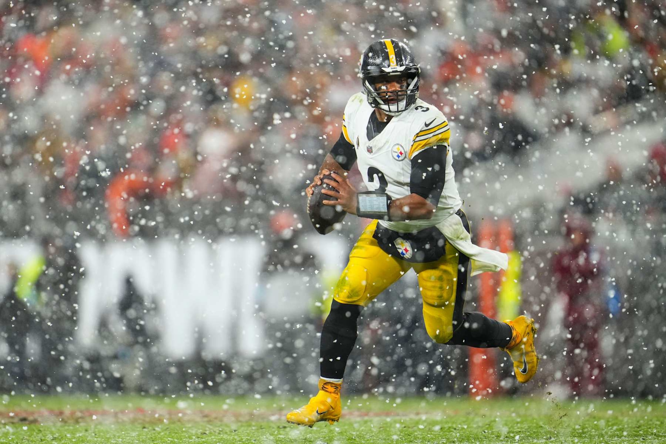 CLEVELAND, OH - NOVEMBER 21: Russell Wilson #3 of the Pittsburgh Steelers scrambles out of the pocket during an NFL football game against the Cleveland Browns at Huntington Bank Field on November 21, 2024 in Cleveland, Ohio. (Photo by Cooper Neill/Getty Images)