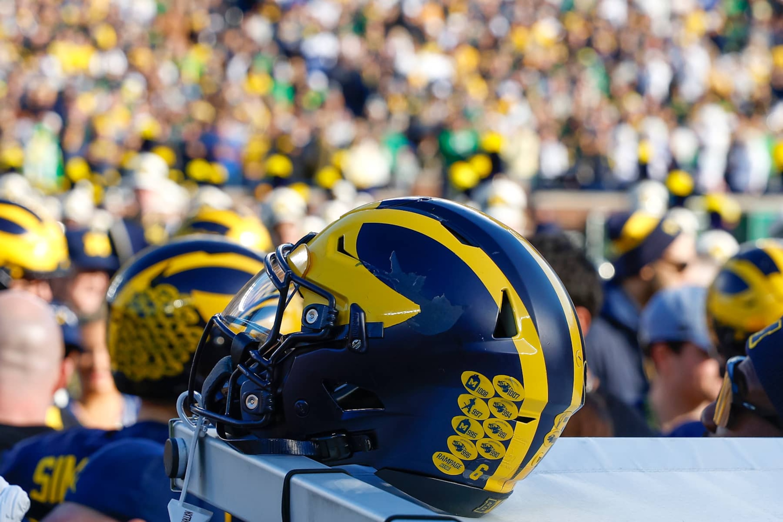 ANN ARBOR, MICHIGAN - NOVEMBER 2: A detail of a Michigan Wolverines helmet on the sideline prior to a game against the Oregon Ducks at Michigan Stadium on November 2, 2024 in Ann Arbor, Michigan. (Photo by Brandon Sloter/Image Of Sport/Getty Images)