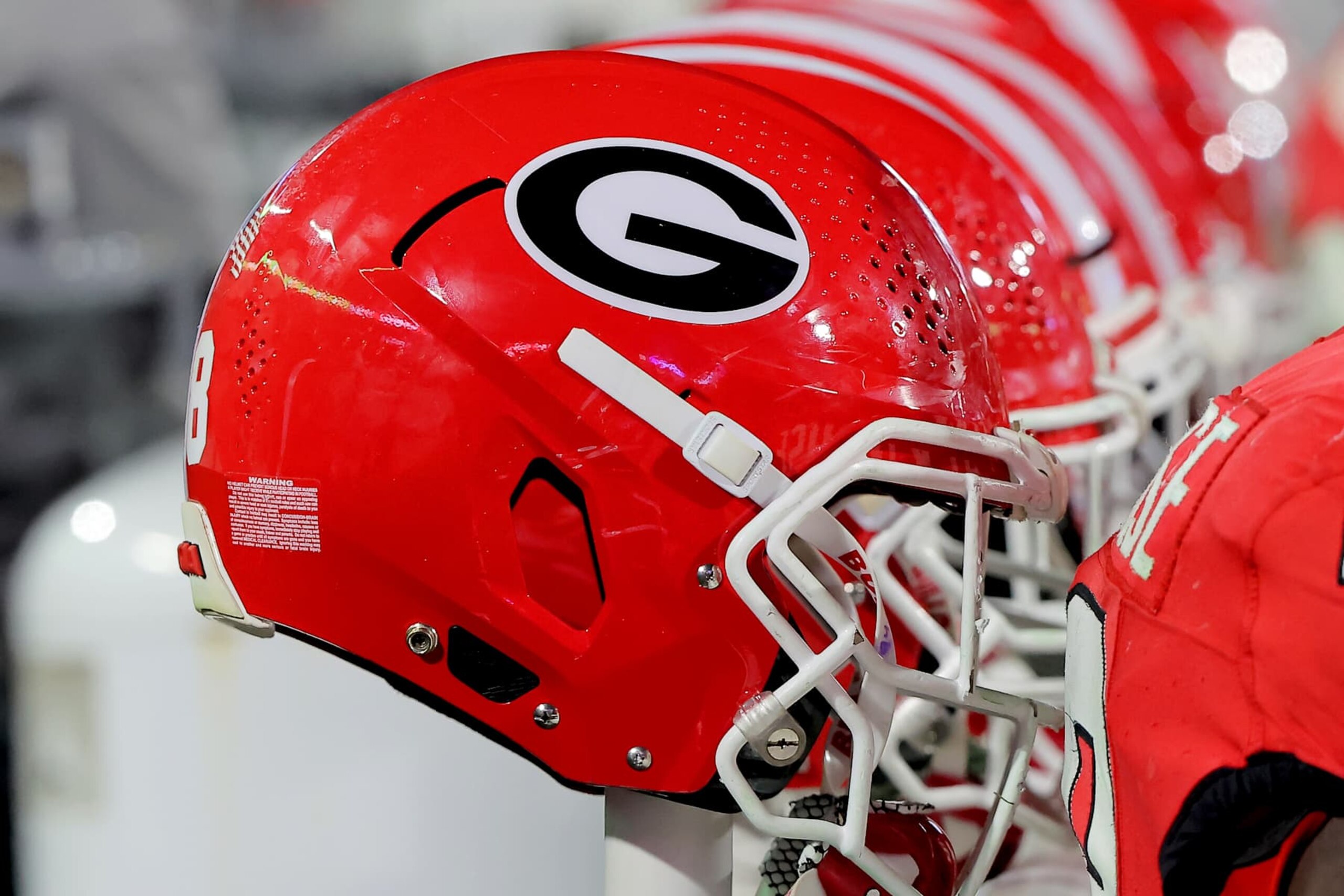 ATHENS, GA - NOVEMBER 16: UGA Bulldog football helmets in the bench area during the Saturday evening college football game between the Tennessee Volunteers and the Georgia Bulldogs on November 16, 2024 on Dooley Field at Sanford Stadium in Athens, GA.  (Photo by David J. Griffin/Icon Sportswire via Getty Images)