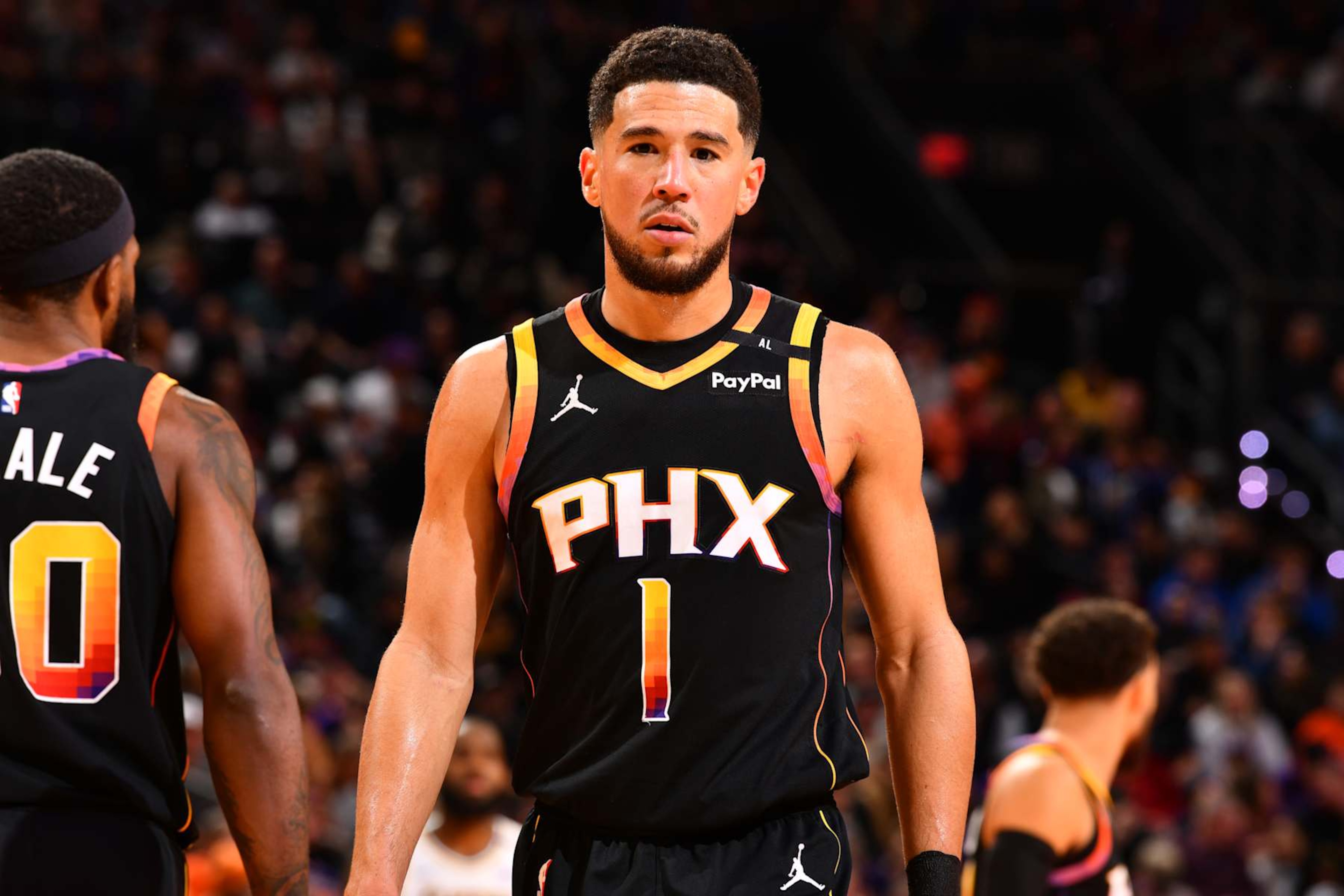 PHOENIX, AZ - NOVEMBER 26: Devin Booker #1 of the Phoenix Suns looks on during the game against the Los Angeles Lakers during the Emirates NBA Cup game on November 26, 2024 at Footprint Center in Phoenix, Arizona. NOTE TO USER: User expressly acknowledges and agrees that, by downloading and or using this photograph, user is consenting to the terms and conditions of the Getty Images License Agreement. Mandatory Copyright Notice: Copyright 2024 NBAE (Photo by Barry Gossage/NBAE via Getty Images) PHOENIX, AZ - NOVEMBER 26: Devin Booker #1 of the Phoenix Suns looks on during the game against the Los Angeles Lakers during the Emirates NBA Cup game on November 26, 2024 at Footprint Center in Phoenix, Arizona. NOTE TO USER: User expressly acknowledges and agrees that, by downloading and or using this photograph, user is consenting to the terms and conditions of the Getty Images License Agreement. Mandatory Copyright Notice: Copyright 2024 NBAE (Photo by Barry Gossage/NBAE via Getty Images)