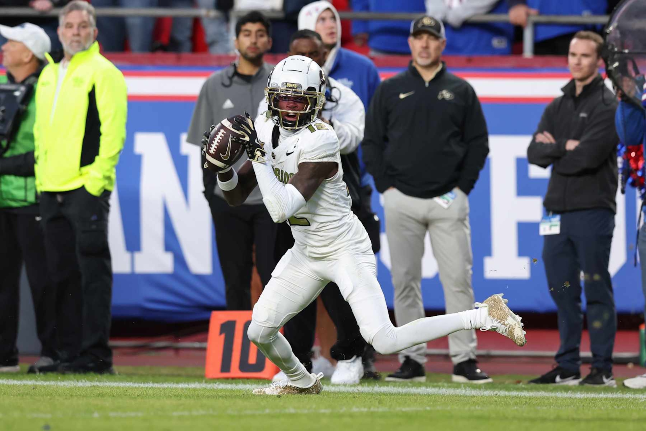KANSAS CITY, MO - NOVEMBER 23: Colorado Buffaloes wide receiver Travis Hunter (12) makes a reception for a 26-yard touchdown in the third quarter of a Big 12 game between the Colorado Buffaloes and Kansas Jayhawks on November 23, 2024 at GEHA Field at Arrowhead Stadium in Kansas City, MO. (Photo by Scott Winters/Icon Sportswire via Getty Images)