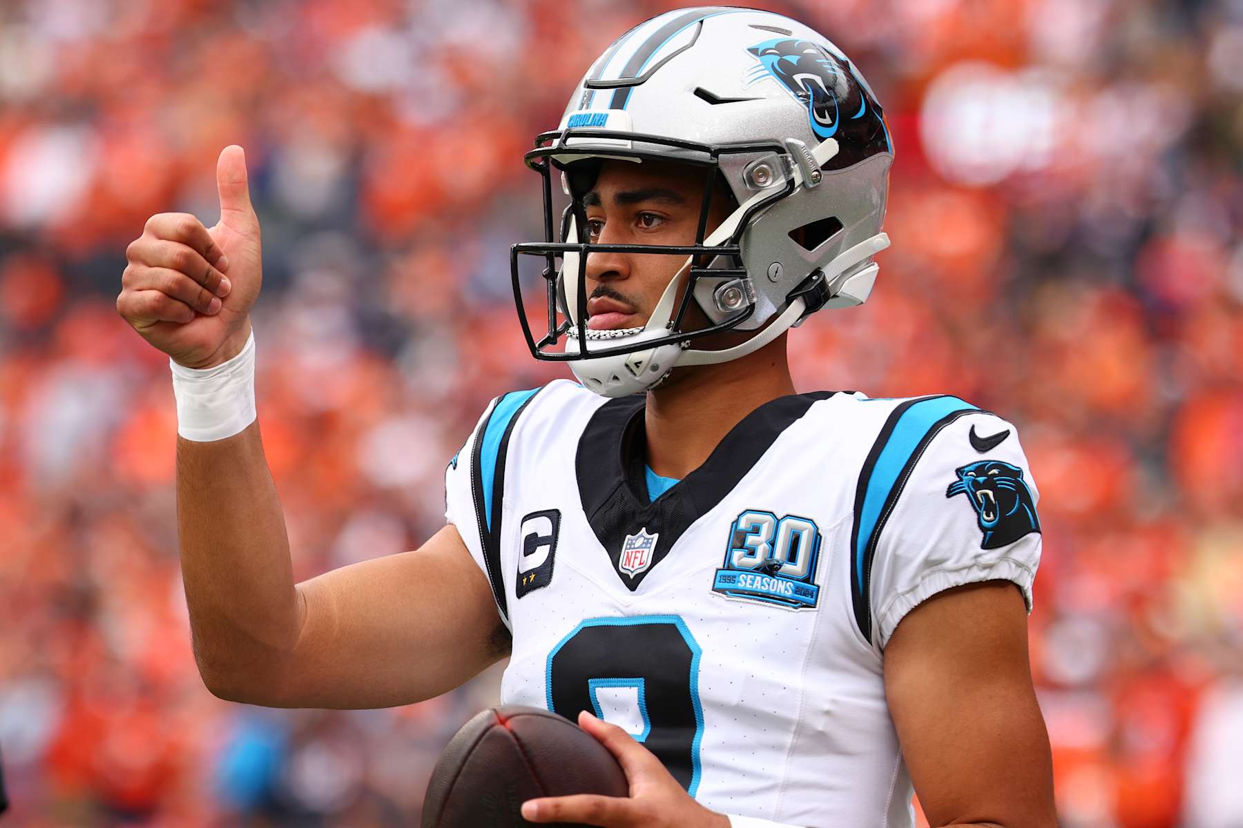 DENVER, COLORADO - OCTOBER 27: Bryce Young #9 of the Carolina Panthers warms up against the Denver Broncos at Empower Field At Mile High on October 27, 2024 in Denver, Colorado. The Broncos defeated the Panthers 28-14. (Photo by C. Morgan Engel/Getty Images)