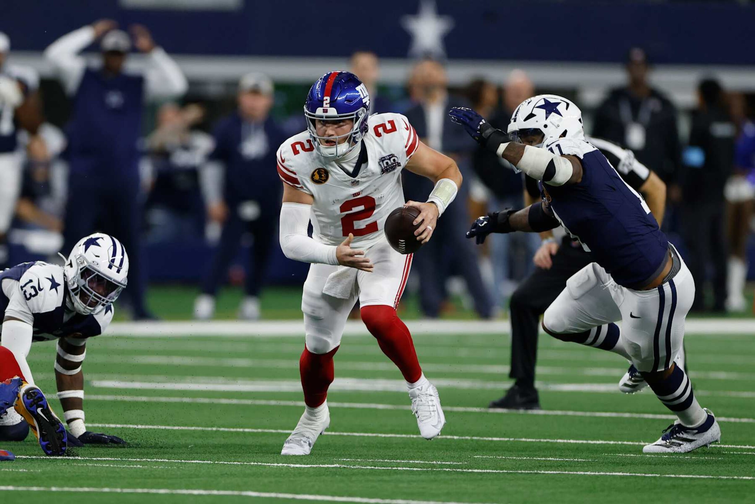 ARLINGTON, TEXAS - NOVEMBER 28: Drew Lock #2 of the New York Giants runs the ball against Micah Parsons #11 of the Dallas Cowboys during the first quarter at AT&T Stadium on November 28, 2024 in Arlington, Texas. (Photo by Ron Jenkins/Getty Images) ARLINGTON, TEXAS - NOVEMBER 28: Drew Lock #2 of the New York Giants runs the ball against Micah Parsons #11 of the Dallas Cowboys during the first quarter at AT&T Stadium on November 28, 2024 in Arlington, Texas. (Photo by Ron Jenkins/Getty Images)
