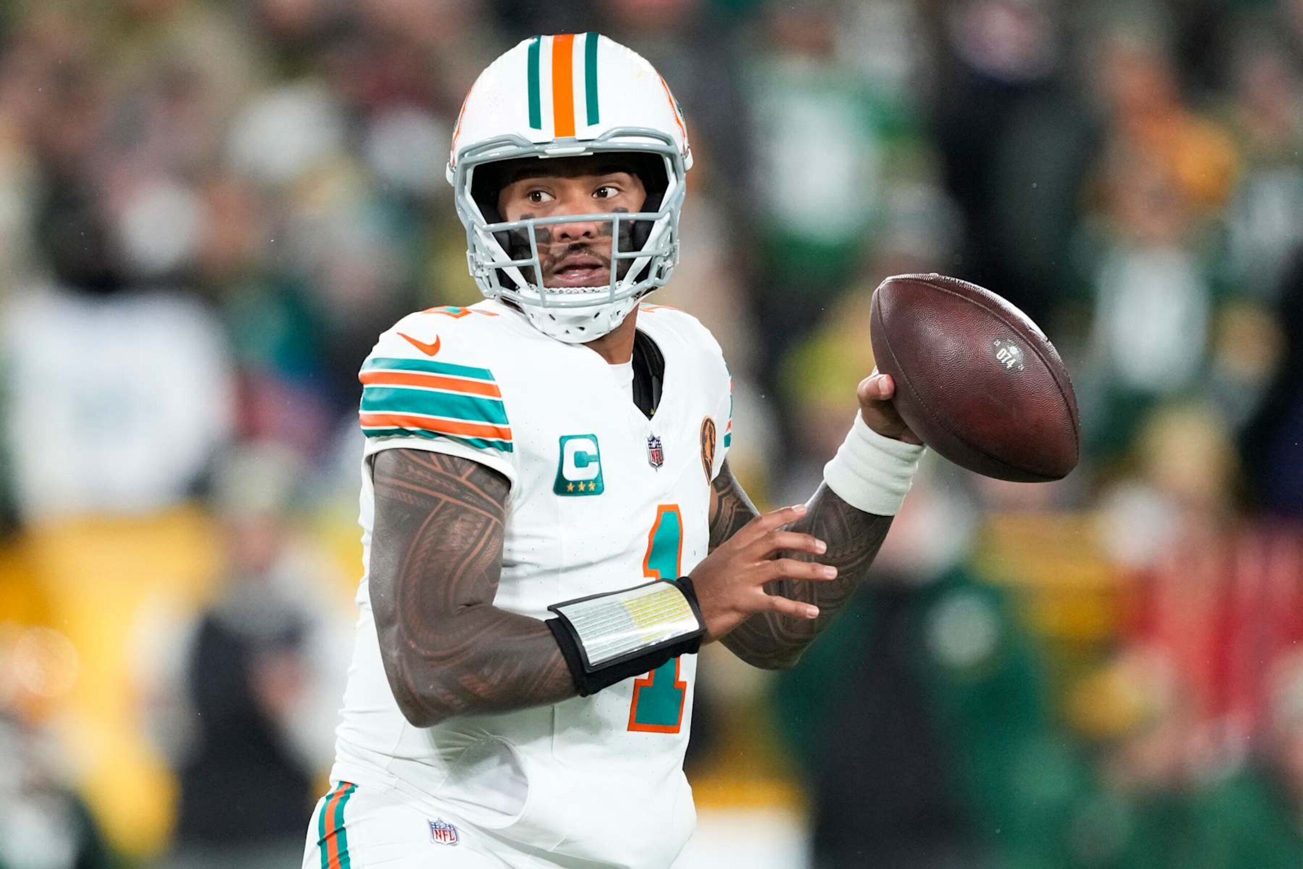 GREEN BAY, WISCONSIN - NOVEMBER 28: Tua Tagovailoa #1 of the Miami Dolphins throws a pass against the Green Bay Packers during the first quarter of the game at Lambeau Field on November 28, 2024 in Green Bay, Wisconsin. (Photo by Patrick McDermott/Getty Images) GREEN BAY, WISCONSIN - NOVEMBER 28: Tua Tagovailoa #1 of the Miami Dolphins throws a pass against the Green Bay Packers during the first quarter of the game at Lambeau Field on November 28, 2024 in Green Bay, Wisconsin. (Photo by Patrick McDermott/Getty Images)