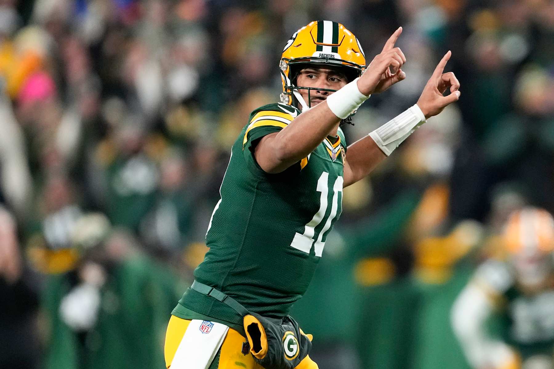 GREEN BAY, WISCONSIN - NOVEMBER 28: Jordan Love #10 of the Green Bay Packers celebrates a touchdown against the Miami Dolphins during the second quarter of the game at Lambeau Field on November 28, 2024 in Green Bay, Wisconsin. (Photo by Patrick McDermott/Getty Images)
