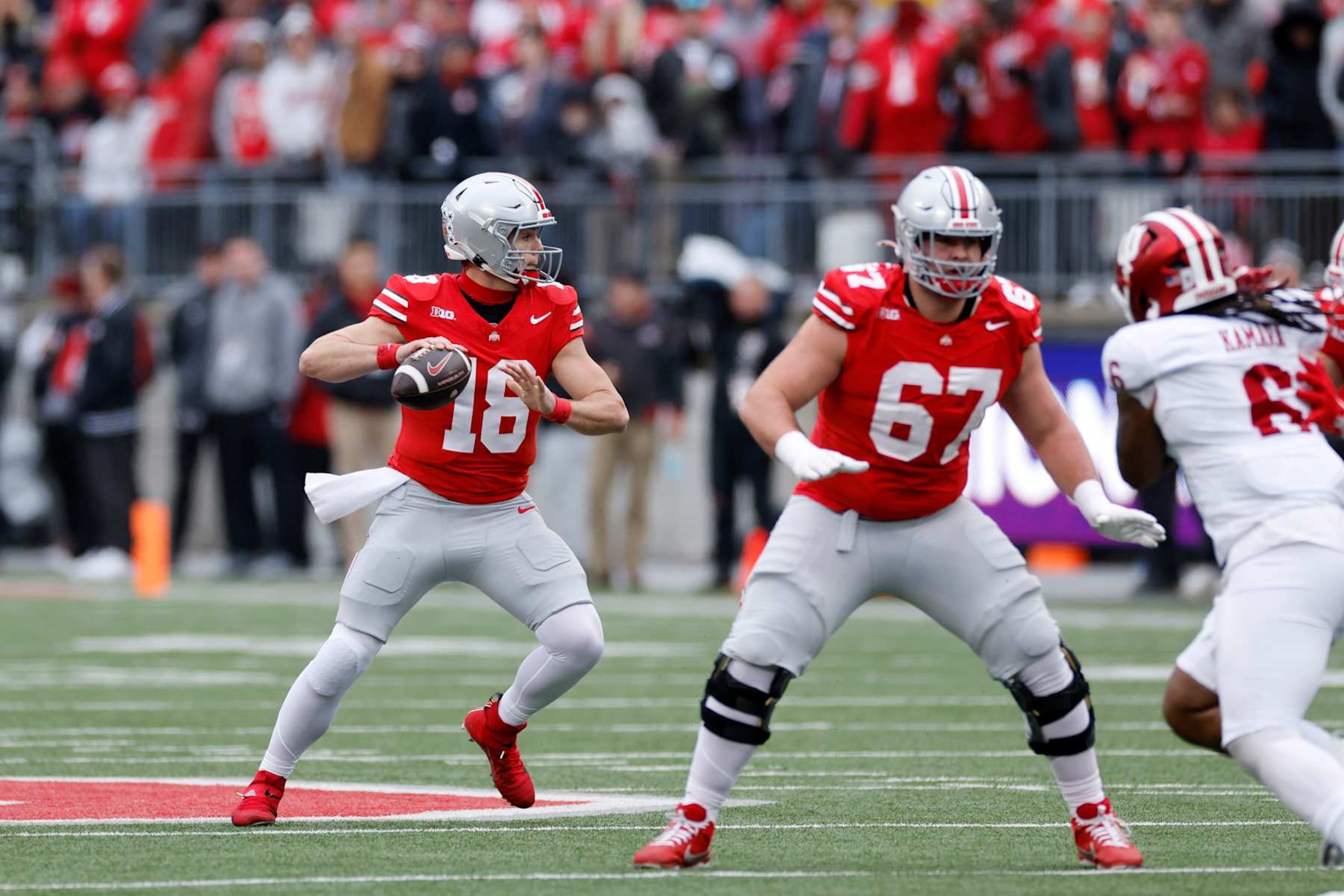 COLUMBUS, OH - NOVEMBER 23: Ohio State Buckeyes quarterback Will Howard (18) looks to pass the ball during a college football game against the Indiana Hoosiers on November 23, 2024 at Ohio Stadium in Columbus, Ohio. (Photo by Joe Robbins/Icon Sportswire via Getty Images) COLUMBUS, OH - NOVEMBER 23: Ohio State Buckeyes quarterback Will Howard (18) looks to pass the ball during a college football game against the Indiana Hoosiers on November 23, 2024 at Ohio Stadium in Columbus, Ohio. (Photo by Joe Robbins/Icon Sportswire via Getty Images)