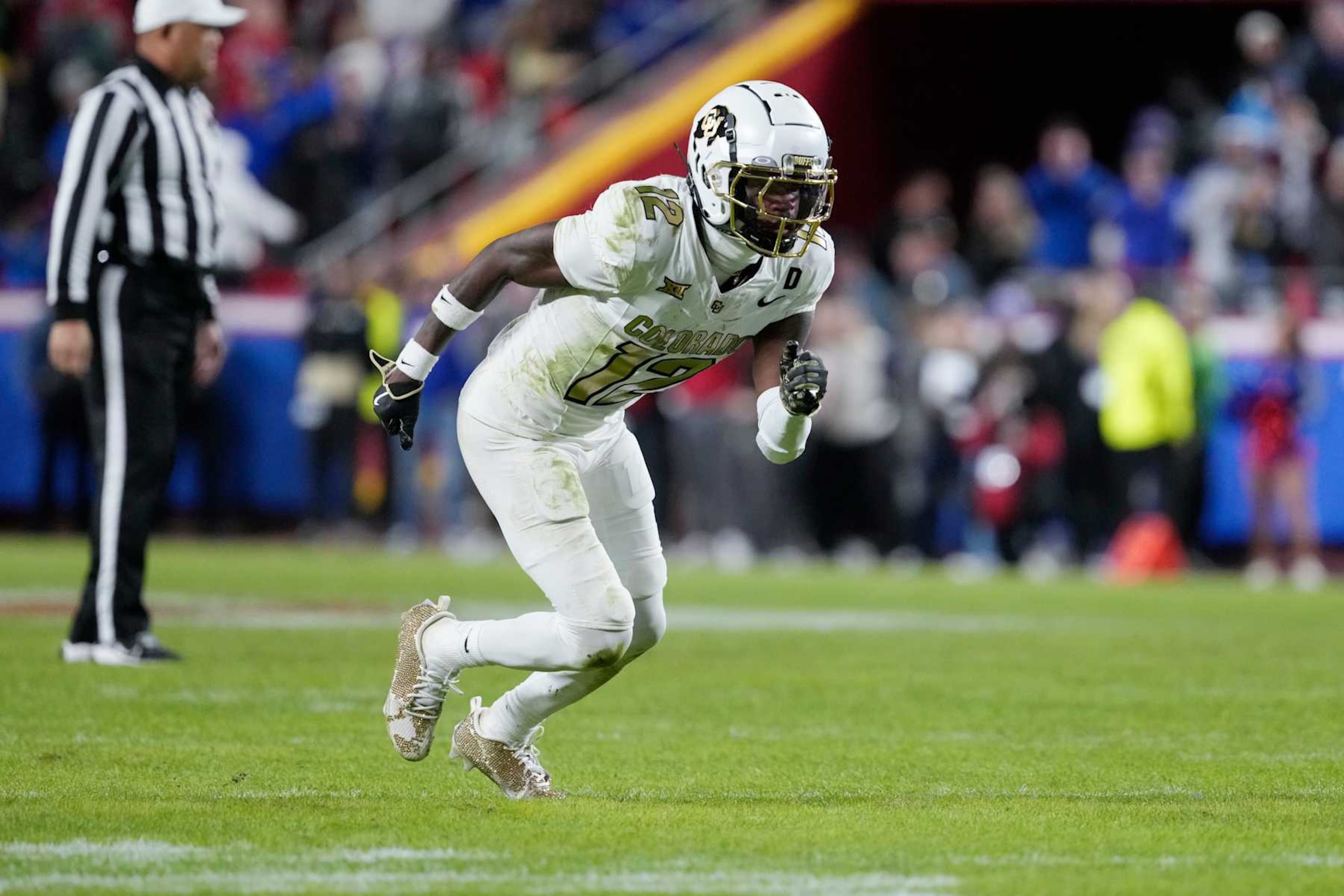 KANSAS CITY, MISSOURI - NOVEMBER 23: Wide receiver Travis Hunter #12 of the Colorado Buffaloes in action in the second half against the Kansas Jayhawks at Arrowhead Stadium on November 23, 2024 in Kansas City, Missouri. (Photo by Ed Zurga/Getty Images) KANSAS CITY, MISSOURI - NOVEMBER 23: Wide receiver Travis Hunter #12 of the Colorado Buffaloes in action in the second half against the Kansas Jayhawks at Arrowhead Stadium on November 23, 2024 in Kansas City, Missouri. (Photo by Ed Zurga/Getty Images)