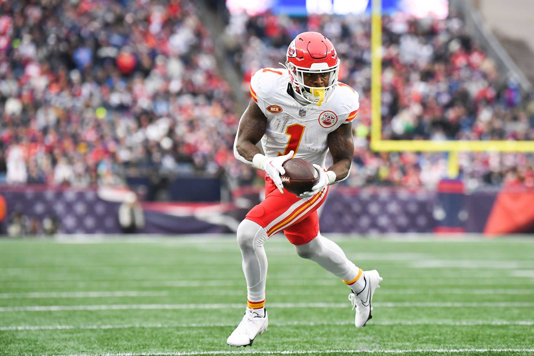 FOXBORO, MA - DECEMBER 17: Jerick McKinnon #1 of the Kansas City Chiefs runs with the football during the first half against the New England Patriots at Gillette Stadium on December 17, 2023 in Foxboro, Massachusetts. (Photo by Kathryn Riley/Getty Images)