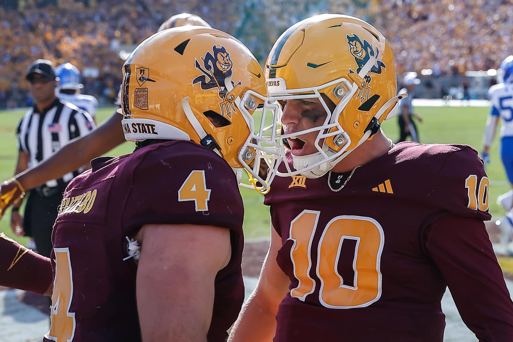 TEMPE, AZ - NOVEMBER 23:  Arizona State Sun Devils quarterback Sam Leavitt (10) and Arizona State Sun Devils running back Cam Skattebo (4) celebrate a touchdown during the college football game between the BYU Cougars and the Arizona State Sun Devils on November 23, 2024 at Mountain America Stadium in Tempe, Arizona. (Photo by Kevin Abele/Icon Sportswire via Getty Images)