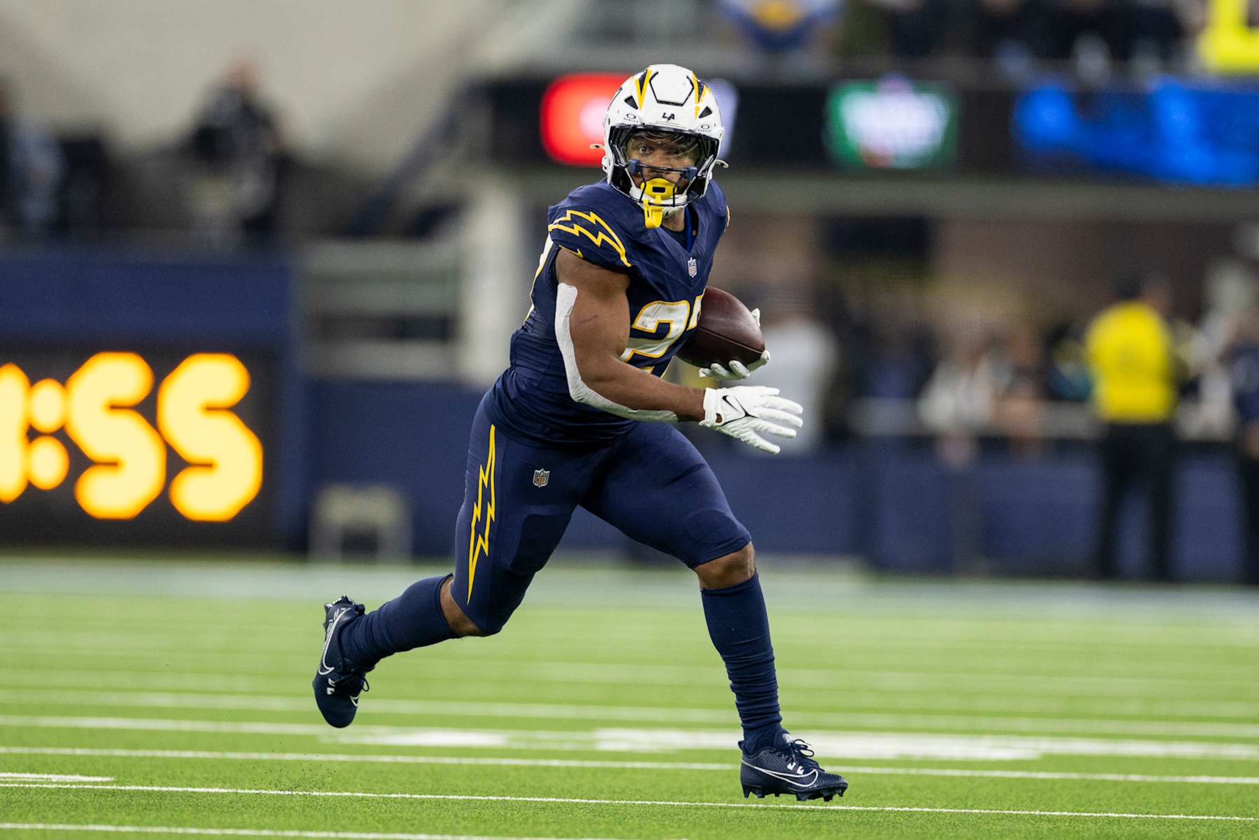 INGLEWOOD, CALIFORINA - NOVEMBER 25: J.K. Dobbins #27 of the Los Angeles Chargers runs with the ball during an NFL Football game against the Baltimore Ravens at SoFi Stadium on November 25, 2024 in Inglewood, Califorina. (Photo by Michael Owens/Getty Images) INGLEWOOD, CALIFORINA - NOVEMBER 25: J.K. Dobbins #27 of the Los Angeles Chargers runs with the ball during an NFL Football game against the Baltimore Ravens at SoFi Stadium on November 25, 2024 in Inglewood, Califorina. (Photo by Michael Owens/Getty Images)