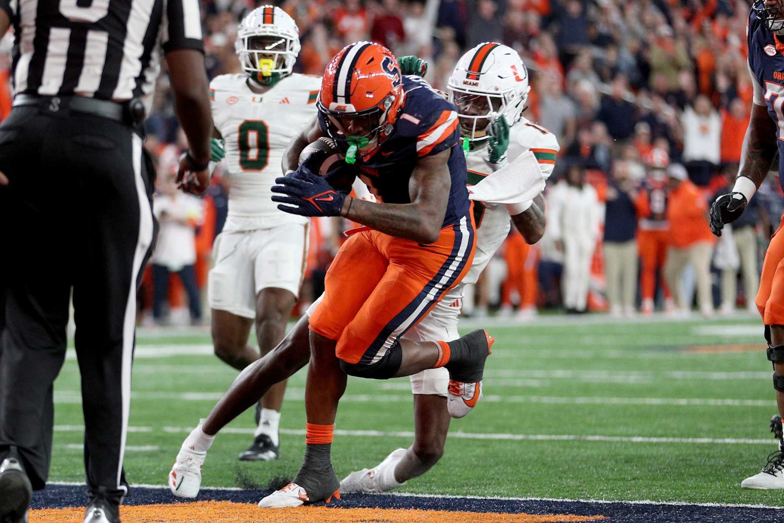 SYRACUSE, NEW YORK - NOVEMBER 30: LeQuint Allen #1 of the Syracuse Orange scores a touchdown during the second quarter against the Miami Hurricanes at JMA Wireless Dome on November 30, 2024 in Syracuse, New York. (Photo by Bryan M. Bennett/Getty Images)
