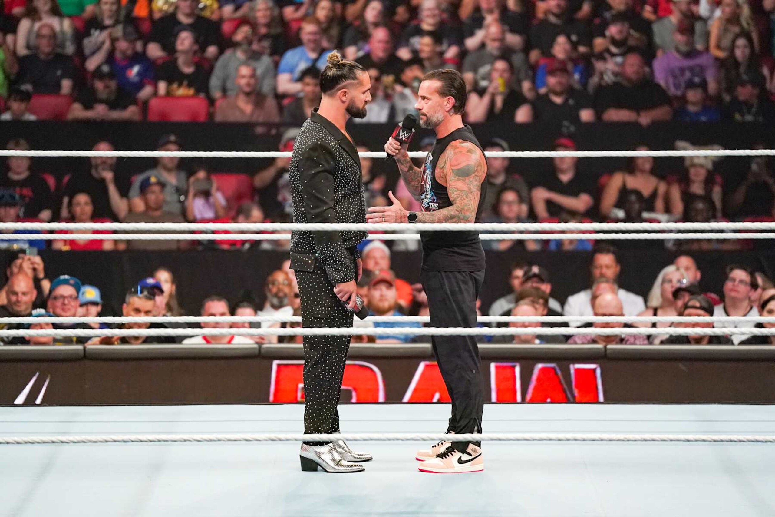 OTTAWA, CANADA - JULY 8: Seth Rollins and CM Punk have a chat in the ring during Monday Night RAW at Canadian Tire Centre on July 8, 2024 in Ottawa, Ontario. (Photo by WWE/Getty Images) OTTAWA, CANADA - JULY 8: Seth Rollins and CM Punk have a chat in the ring during Monday Night RAW at Canadian Tire Centre on July 8, 2024 in Ottawa, Ontario. (Photo by WWE/Getty Images)