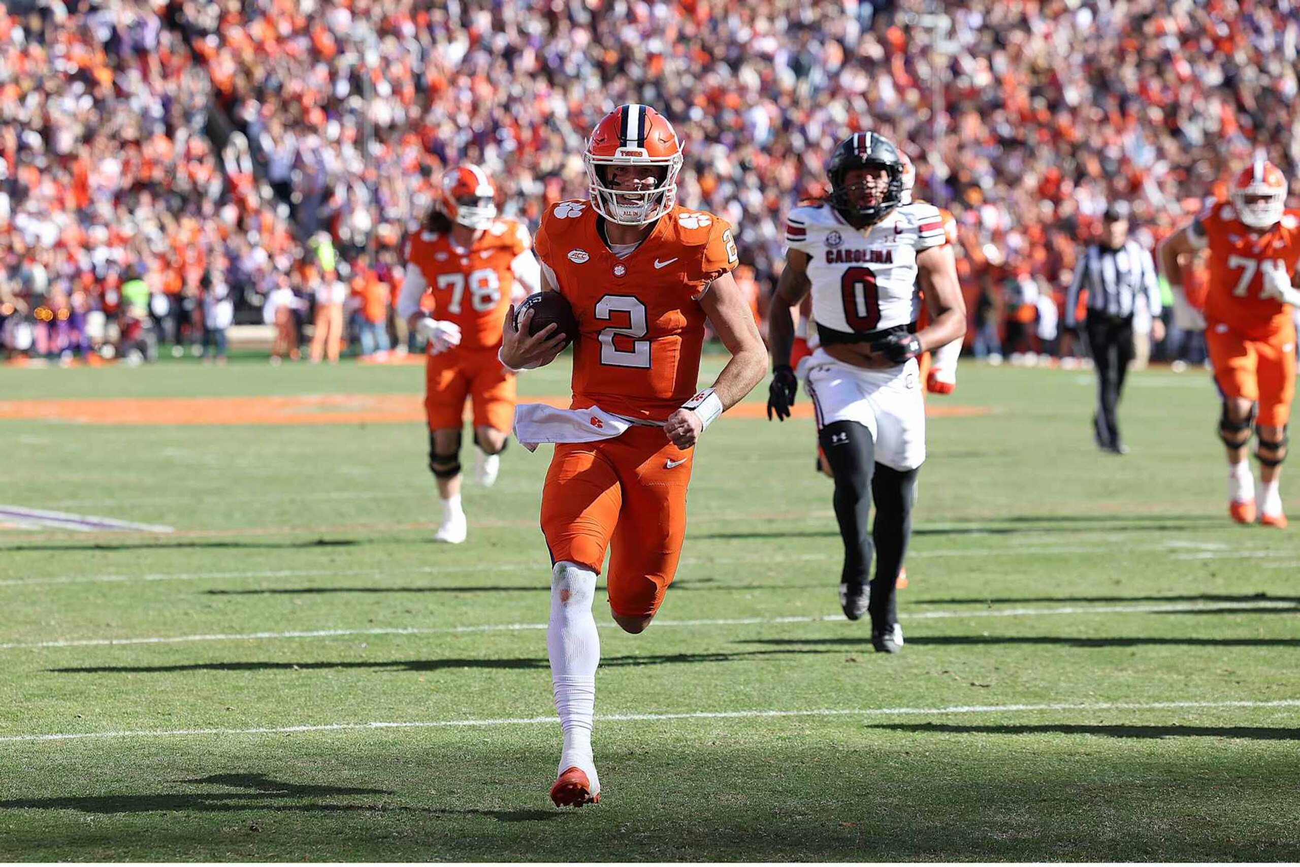 CLEMSON, SC - NOVEMBER 30: Clemson Tigers quarterback Cade Klubnik (2) runs to the end zone for a touchdown during a college football game between the South Carolina Gamecocks and the Clemson Tigers on November 30, 2024 at Clemson Memorial Stadium in Clemson, S.C. (Photo by John Byrum/Icon Sportswire via Getty Images) CLEMSON, SC - NOVEMBER 30: Clemson Tigers quarterback Cade Klubnik (2) runs to the end zone for a touchdown during a college football game between the South Carolina Gamecocks and the Clemson Tigers on November 30, 2024 at Clemson Memorial Stadium in Clemson, S.C. (Photo by John Byrum/Icon Sportswire via Getty Images)