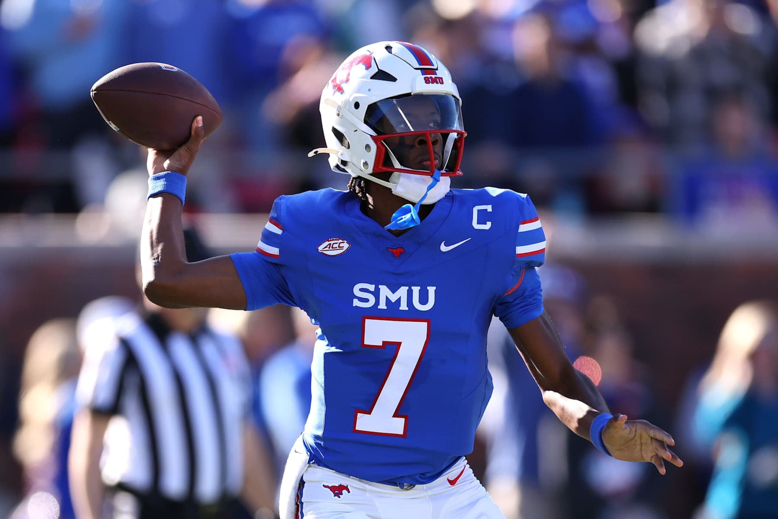 DALLAS, TEXAS - NOVEMBER 30: Kevin Jennings #7 of the Southern Methodist Mustangs throws during the first half of the game against the California Golden Bears at Gerald J. Ford Stadium on November 30, 2024 in Dallas, Texas. (Photo by Sam Hodde/Getty Images) DALLAS, TEXAS - NOVEMBER 30: Kevin Jennings #7 of the Southern Methodist Mustangs throws during the first half of the game against the California Golden Bears at Gerald J. Ford Stadium on November 30, 2024 in Dallas, Texas. (Photo by Sam Hodde/Getty Images)