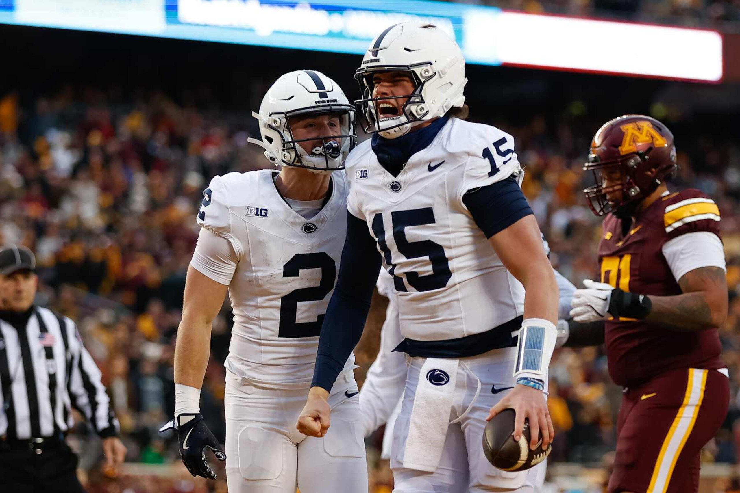 MINNEAPOLIS, MN - NOVEMBER 23: Penn State Nittany Lions quarterback Drew Allar (15) celebrates with wide receiver Liam Clifford (2) after scoring a touchdown during the college football game between the Penn State Nittany Lions and the Minnesota Golden Gophers on November 23rd, 2024, at Huntington Bank Stadium in Minneapolis, MN. (Photo by Bailey Hillesheim/Icon Sportswire via Getty Images)
