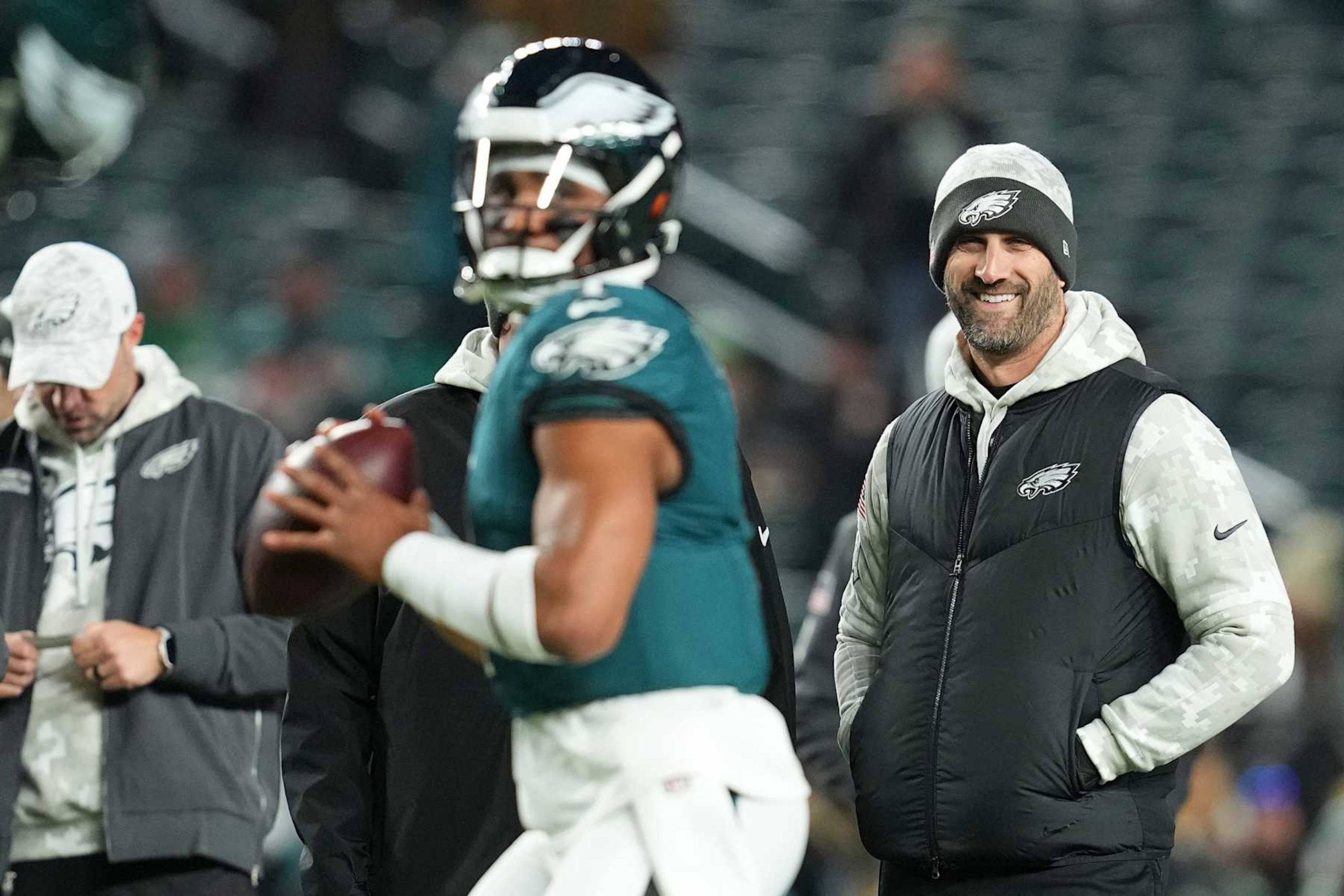 PHILADELPHIA, PENNSYLVANIA - NOVEMBER 14: Head coach Nick Sirianni of the Philadelphia Eagles smiles as Jalen Hurts #1 warms up prior to the game against the Washington Commanders at Lincoln Financial Field on November 14, 2024 in Philadelphia, Pennsylvania. (Photo by Mitchell Leff/Getty Images)