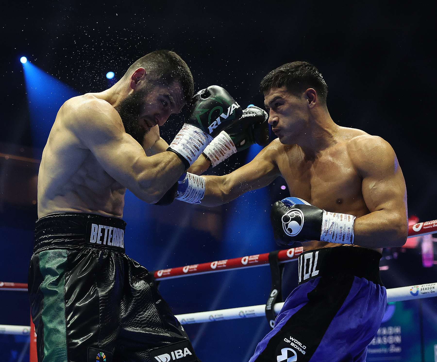 RIYADH, SAUDI ARABIA - OCTOBER 12: Artur Beterbiev (L) fights Dmitry Bivol during their headlining bout as part of the Riyadh Season - IV Crown Showdown at Kingdom Arena on October 12, 2024 in Riyadh, Saudi Arabia. (Photo by Mark Robinson/Matchroom Boxing/Getty Images).
