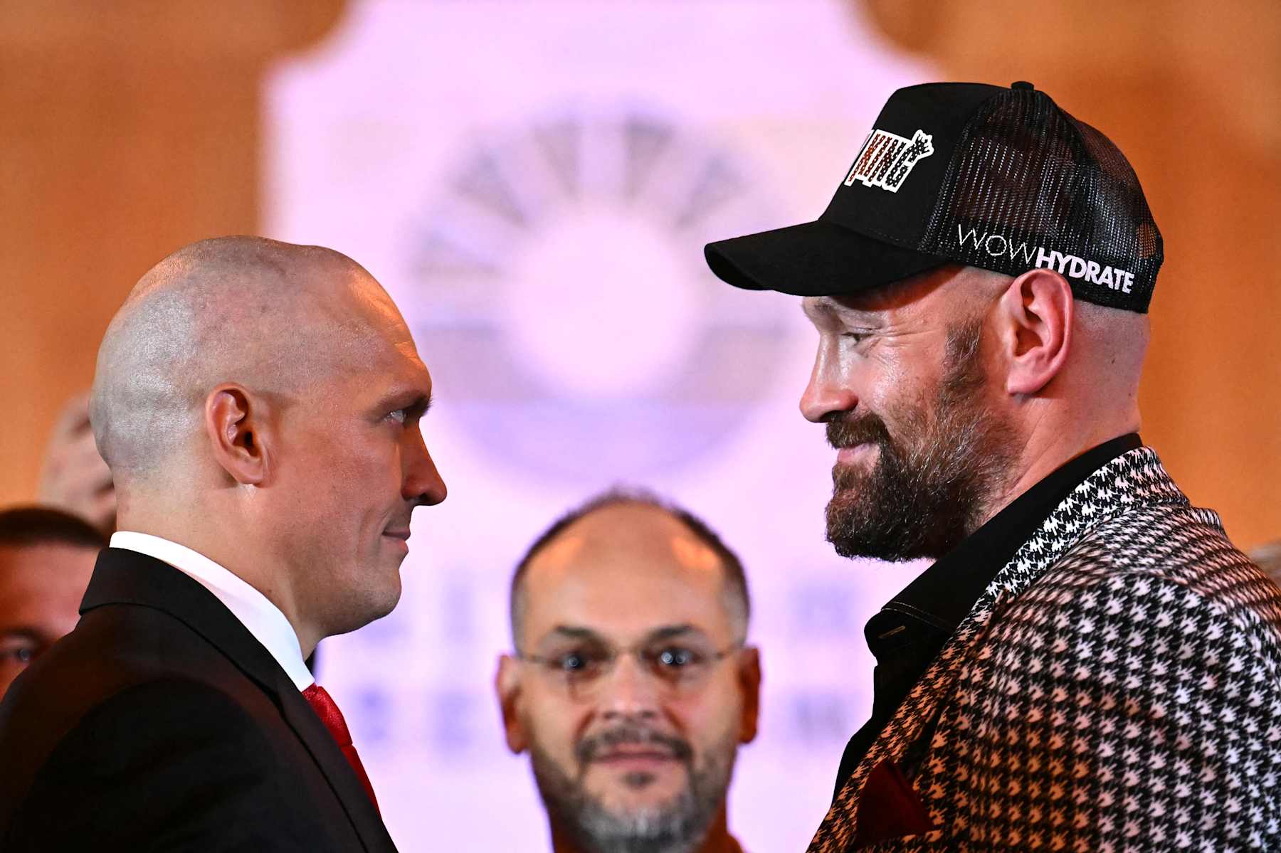Britain's Tyson Fury and Ukraine's Oleksandr Usyk (L) smile at each other during a press conference, in central London, on October 23, 2024, ahead of their undisputed heavyweight world championship rematch, taking place on December 21, 2024 in Riyadh, Saudi Arabia. (Photo by JUSTIN TALLIS / AFP) (Photo by JUSTIN TALLIS/AFP via Getty Images)