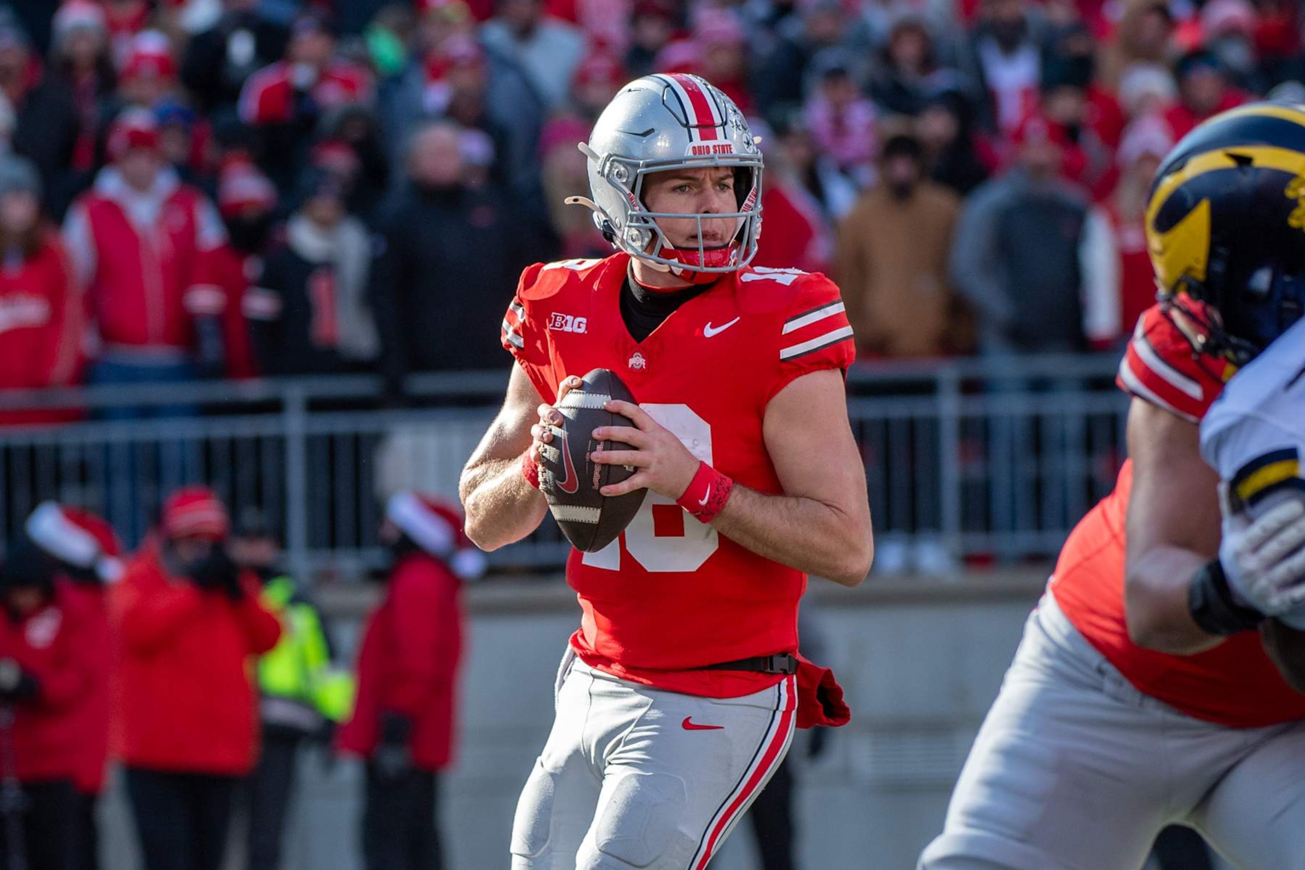 COLUMBUS, OHIO - NOVEMBER 30: Will Howard #18 of the Ohio State Buckeyes looks to throw a pass downfield during the second half of a college football game against the Michigan Wolverines at Ohio Stadium on November 30, 2024 in Columbus, OH. The Michigan Wolverines won the game 13-10. (Photo by Aaron J. Thornton/Getty Images)