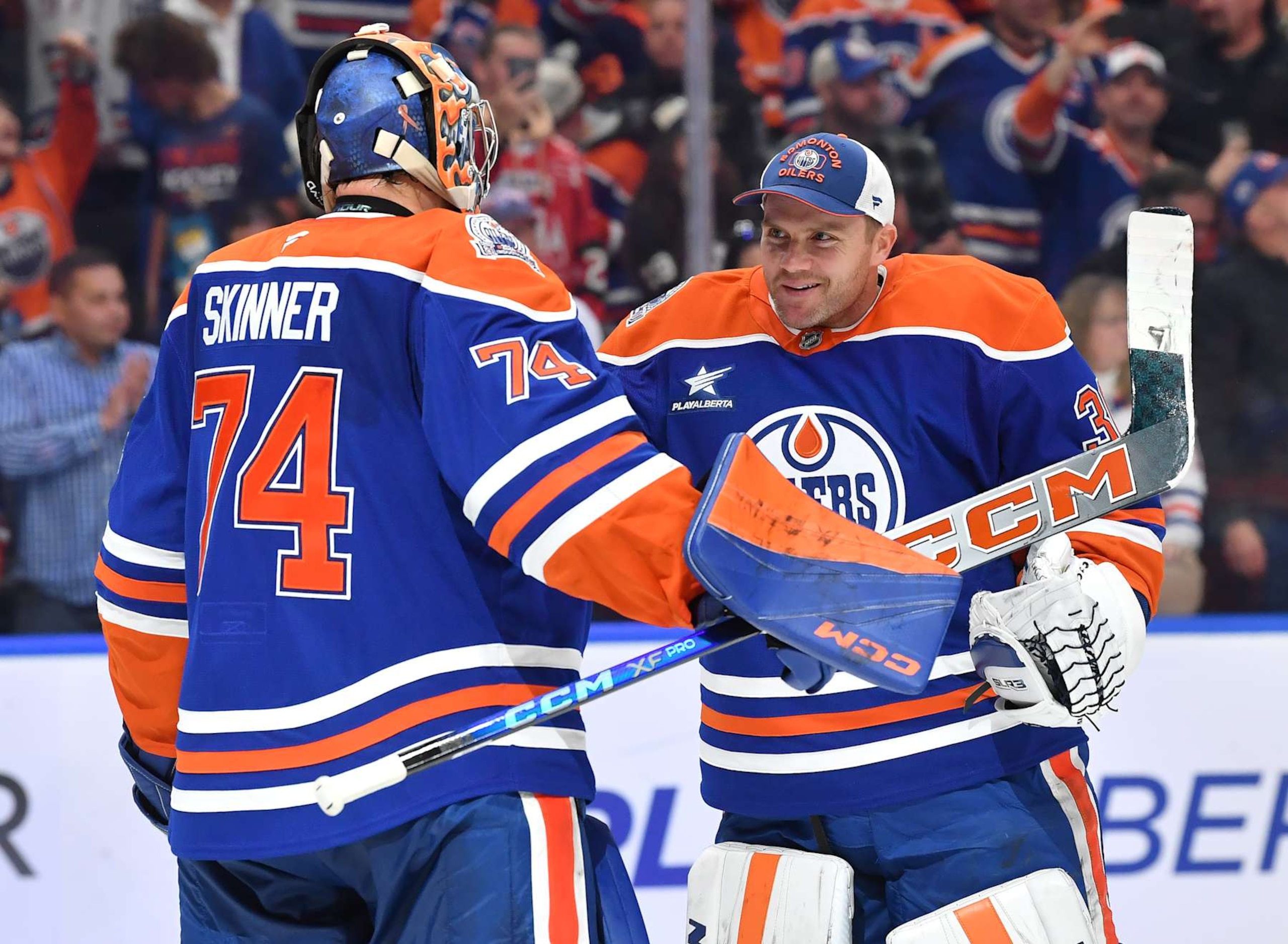 EDMONTON, CANADA - OCTOBER 25: Calvin Pickard #30 and Stuart Skinner #74 of the Edmonton Oilers celebrate a victory over the Pittsburgh Penguins after the game at Rogers Place on October 25, 2024, in Edmonton, Alberta, Canada. (Photo by Andy Devlin/NHLI via Getty Images)