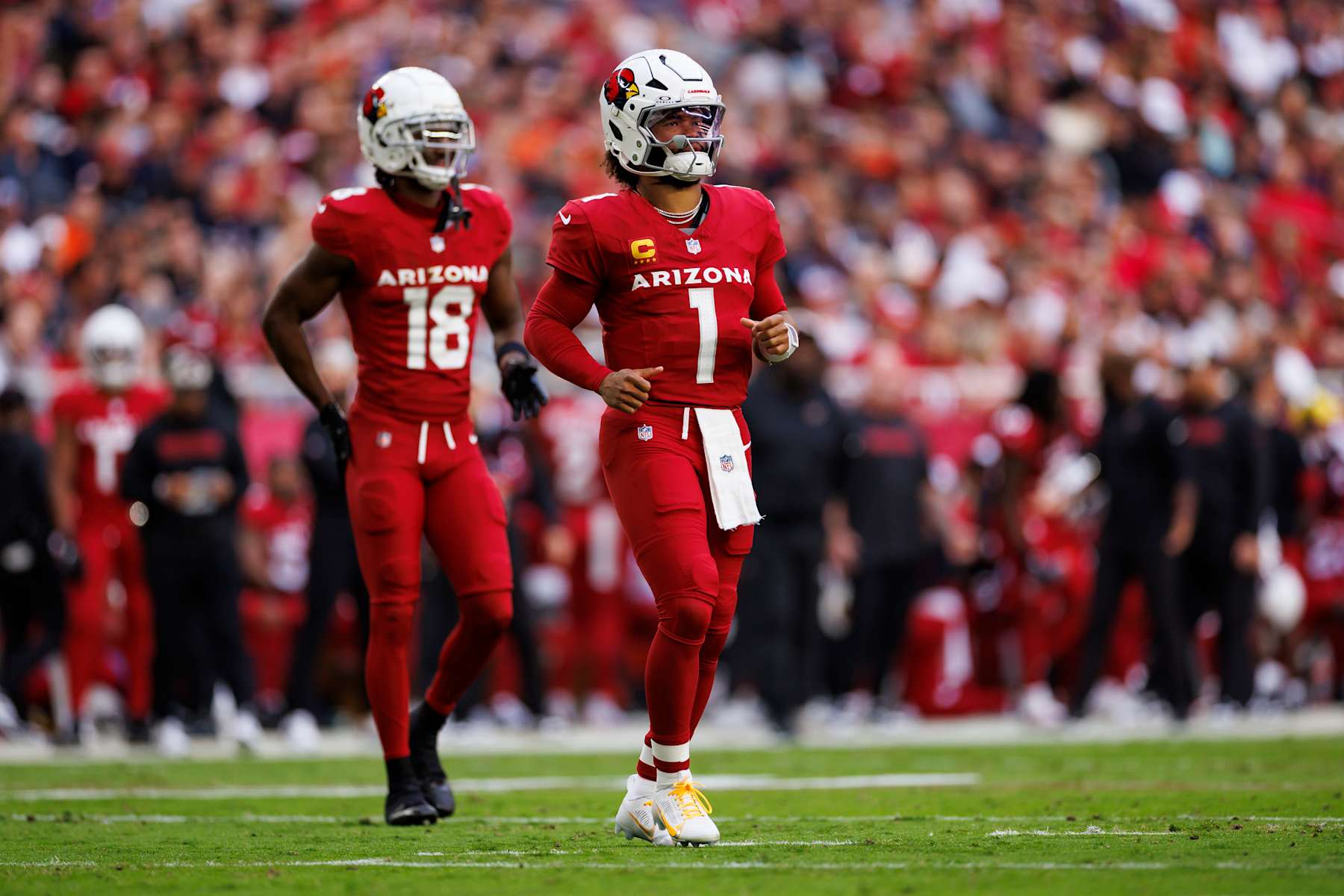 Cardinals wide receiver Marvin Harrison Jr. (left) and quarterback Kyler Murray (right)