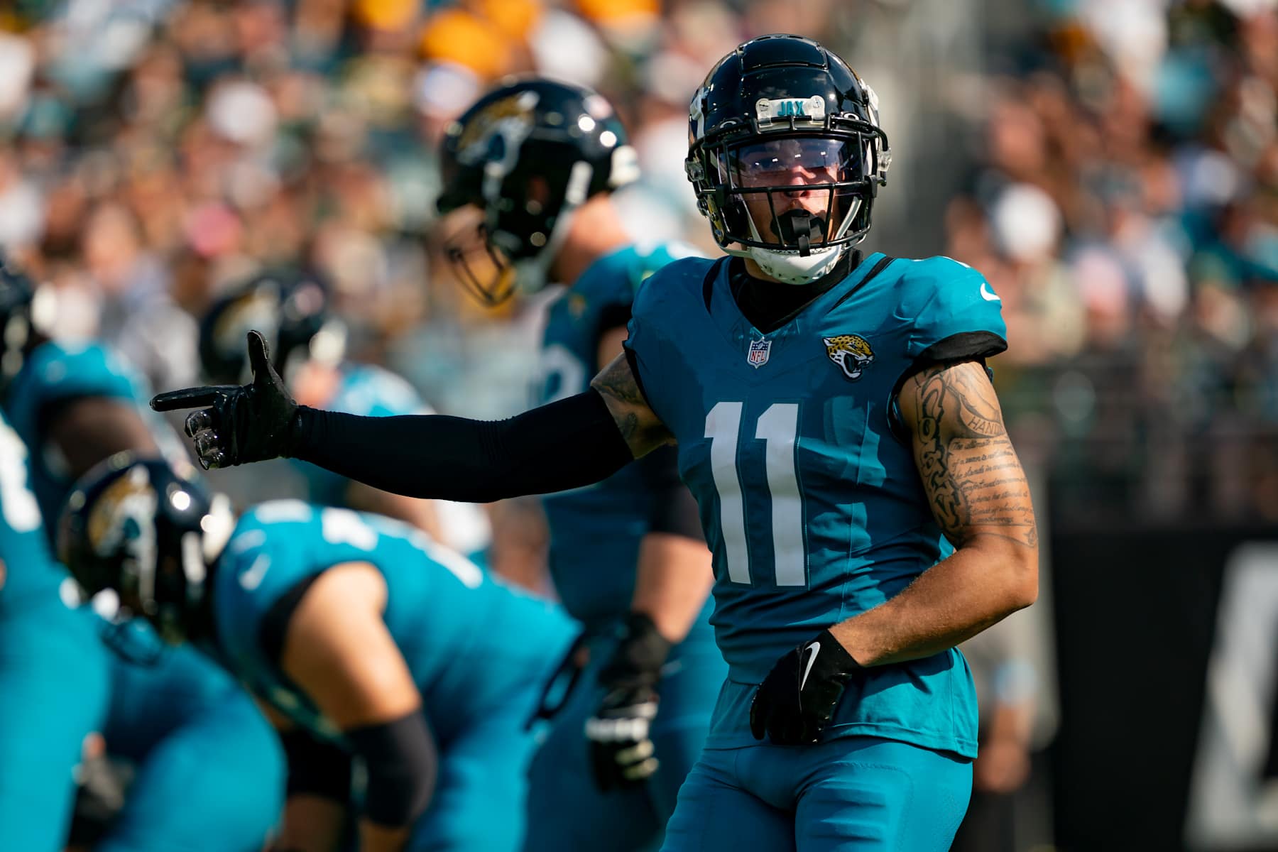 JACKSONVILLE, FL - OCTOBER 27:Jacksonville Jaguars wide receiver Parker Washington (11) signals to the referee  during a NFL football game between the Green Bay Packers and the Jacksonville Jaguars on October 27th, 2024 at EverBank Stadium in Jacksonville, FL. (Photo by Chris Leduc/Icon Sportswire via Getty Images)